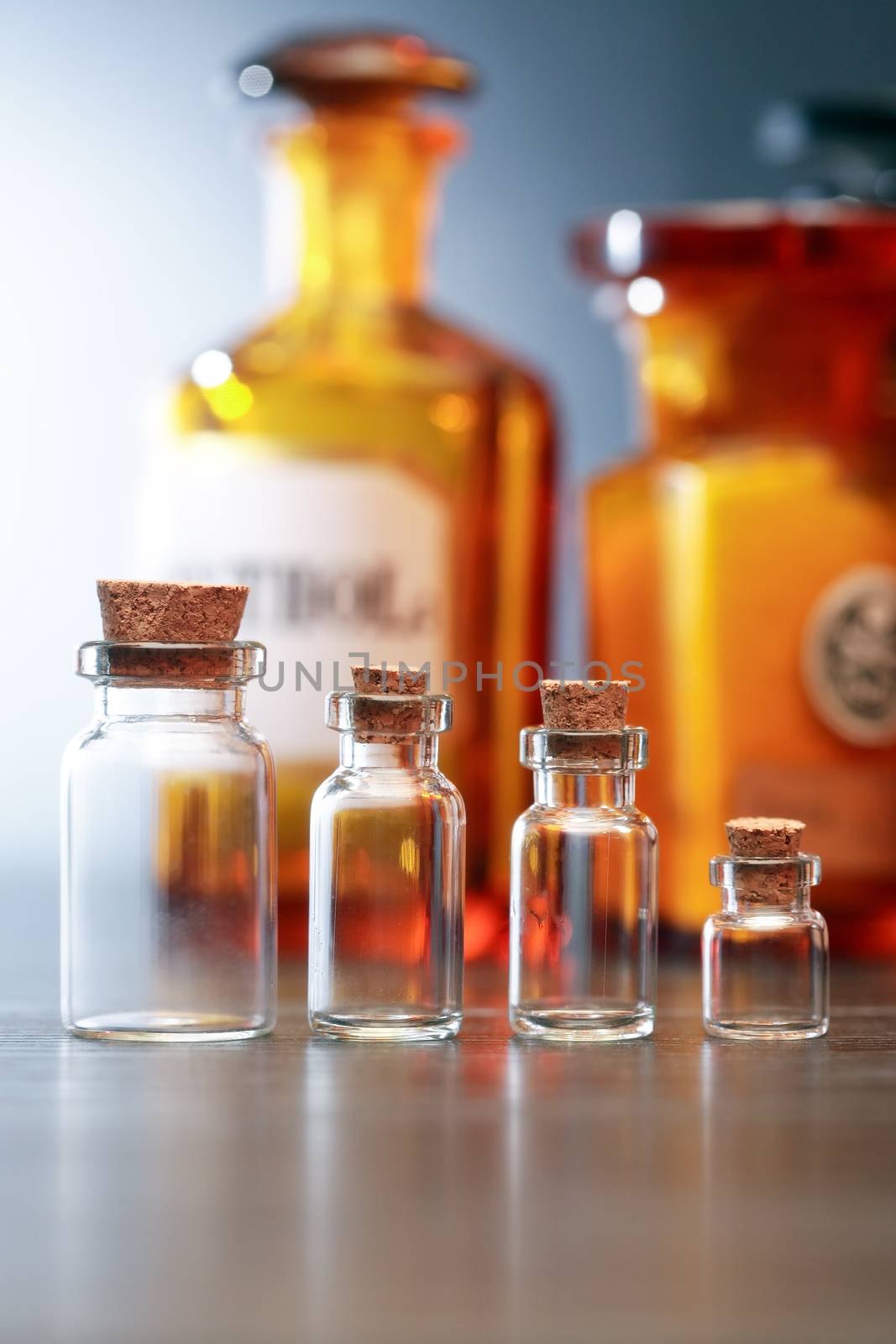 Set of old glass pharmaceutical phials on dark background