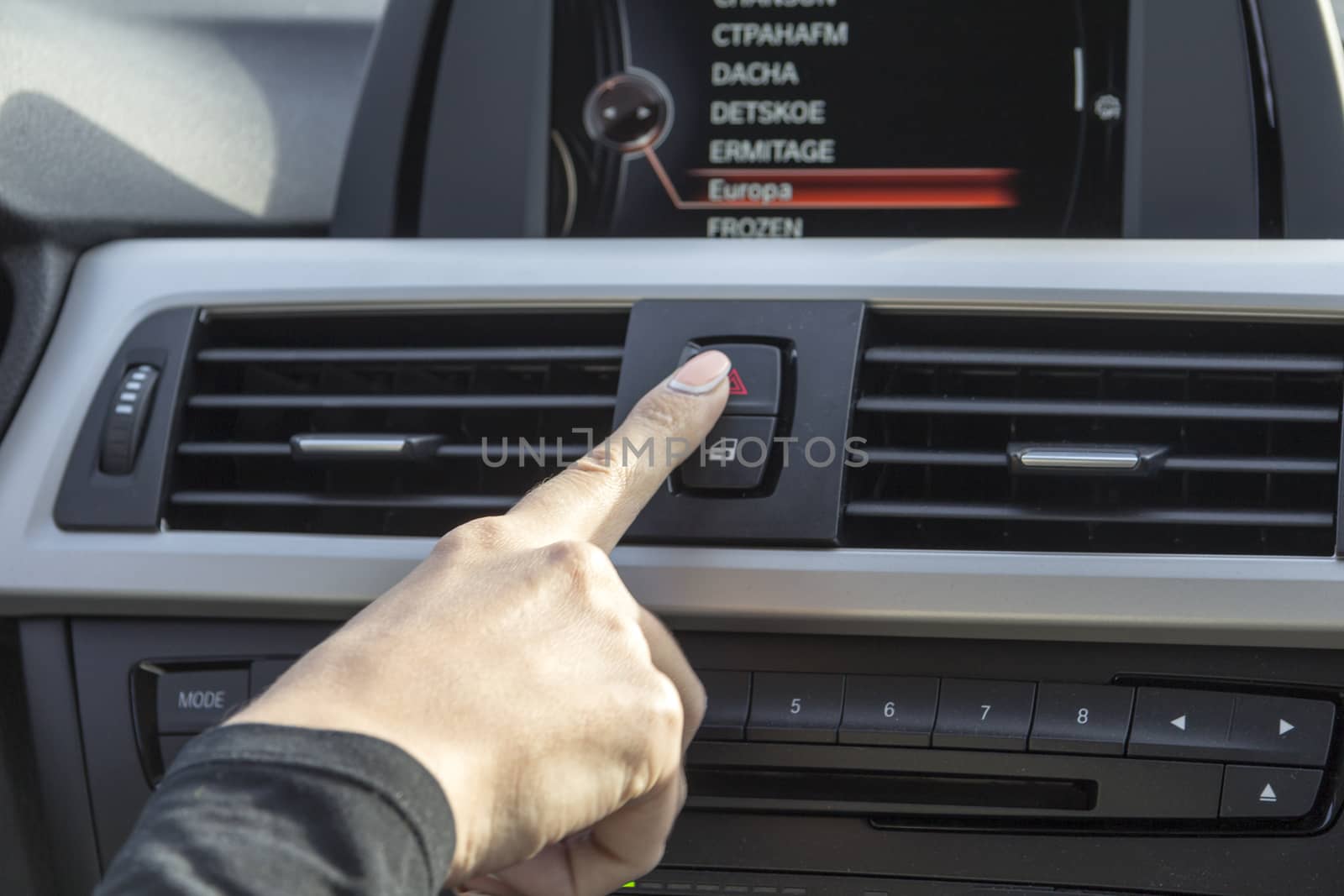 close-up of a girl's hand on the dashboard in a car