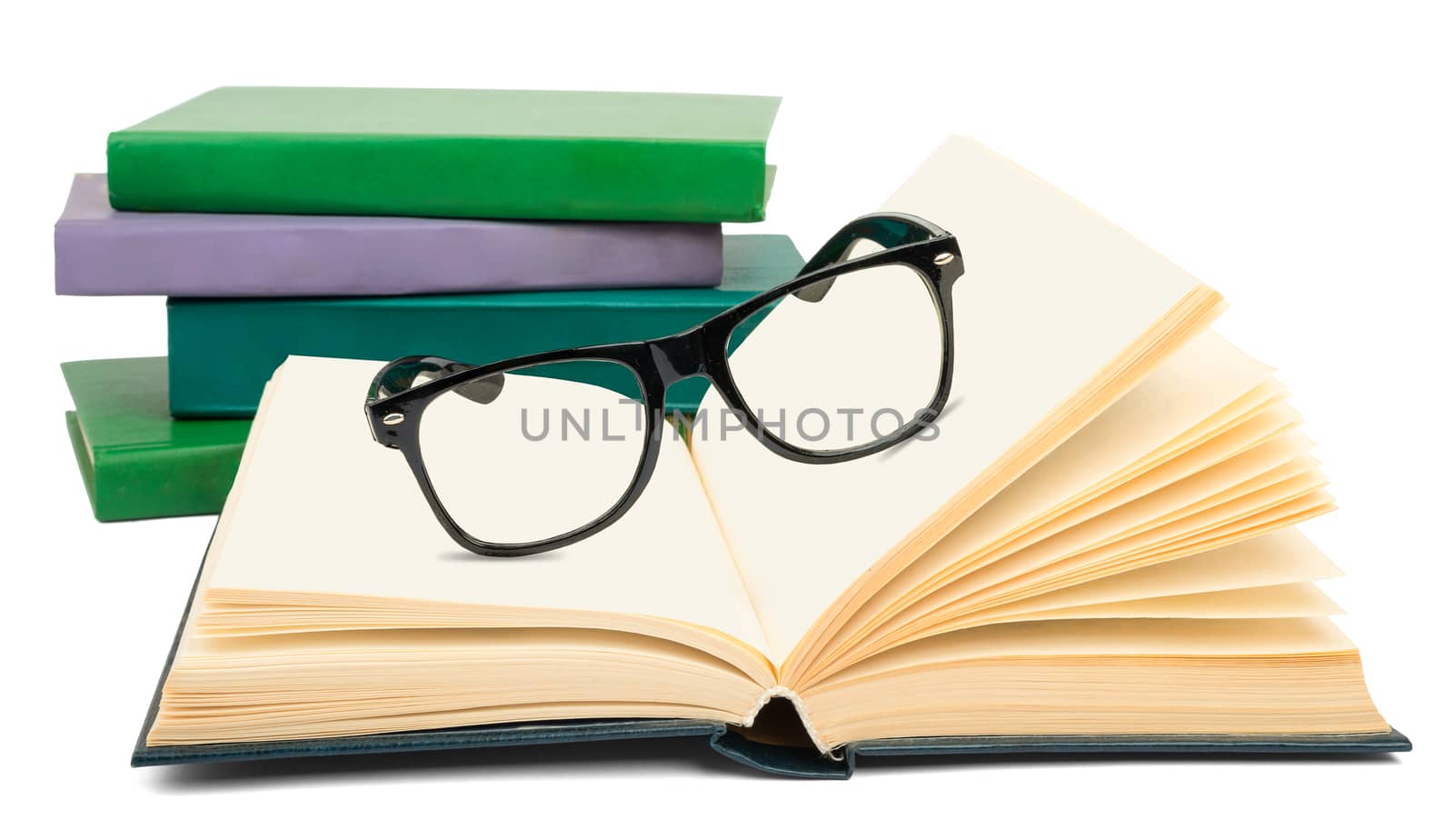 Open book with eyeglasses isolated on white background