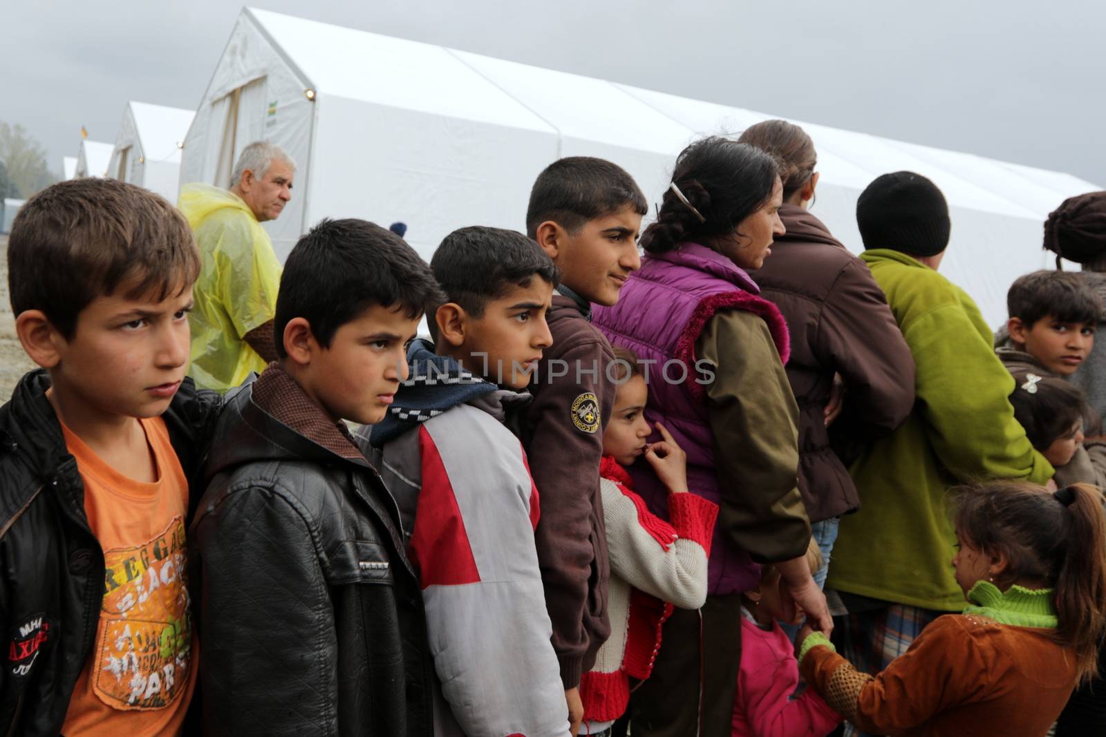 GREECE, Idomeni: Thousands of migrants are stranded in a makeshift camp for migrants and refugees at the Greek-Macedonian border near the village of Idomeni on March 23, 2016. The UN refugee agency harshly criticized an EU-Turkey deal on curbing the influx of migrants to Greece, saying reception centers had become detention facilities, and suspended some activities in the country. The EU and Ankara struck a deal aiming to cut off the sea crossing from Turkey to the Greek islands that enabled 850,000 people to pour into Europe last year, many of them fleeing the brutal war in Syria.