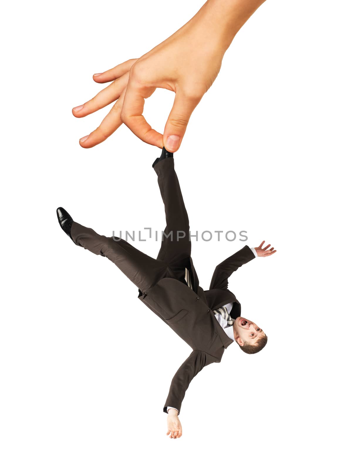 Big hand holding businessman for leg isolated on white background