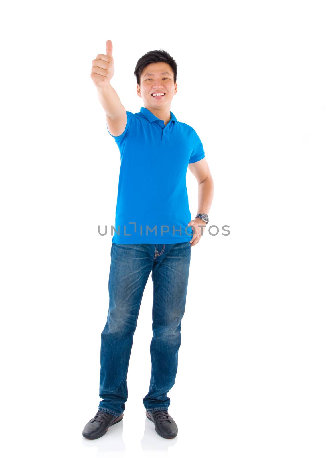 Thumb up middle aged Asian man isolated over white background