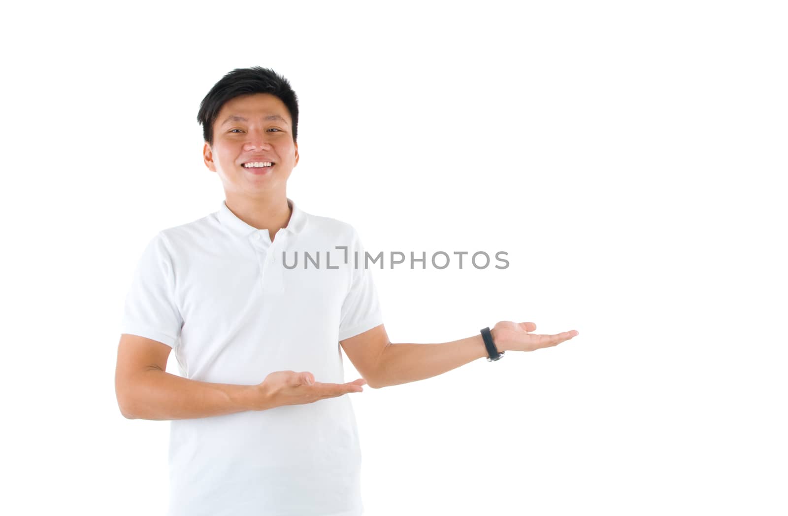 portrait of young happy smiling cheerful asian business man hand showing blank copy space; isolated over white background