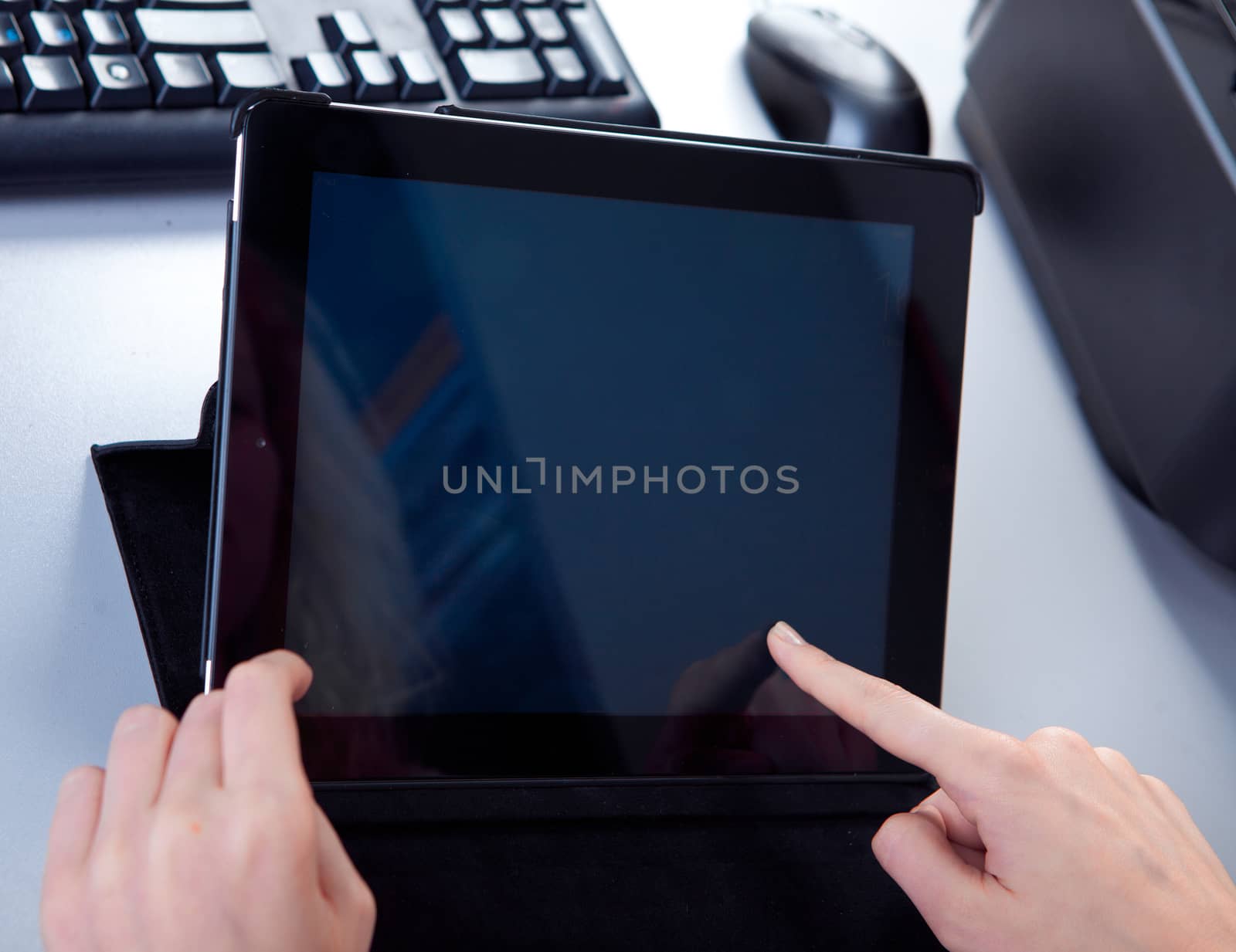 business woman in the workplace is working on a tablet