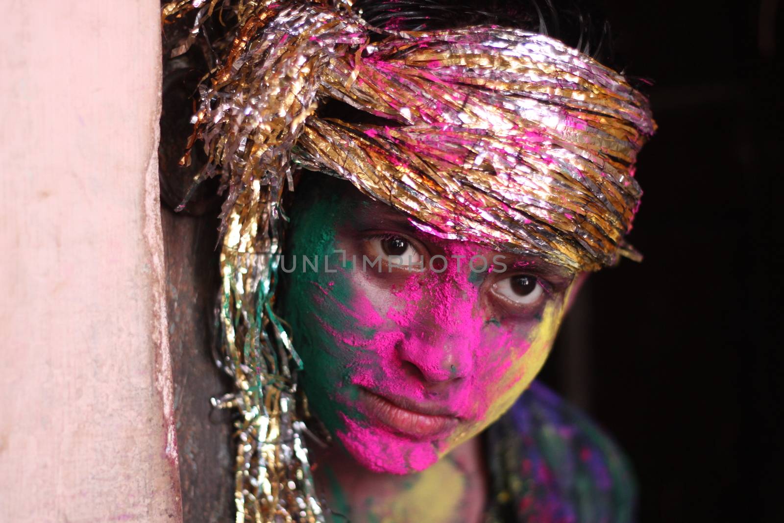 INDIA, Allahabad: A child wears vibrantly colored paints during Holi celebrations in Allahabad, India on March 24, 2016. Hindu devotees splatter each other with paint during Holi celebrations to mark the advent of spring. It is celebrated across the country and in many other countries in the region.