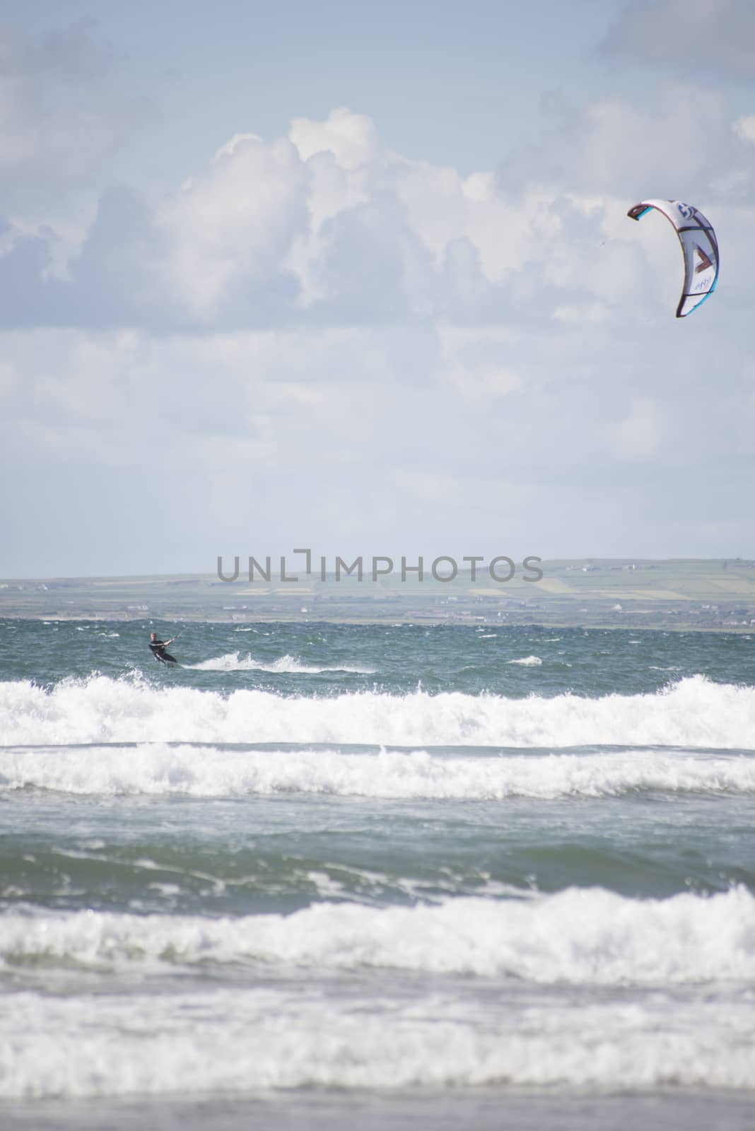 kite surfer on big waves by morrbyte