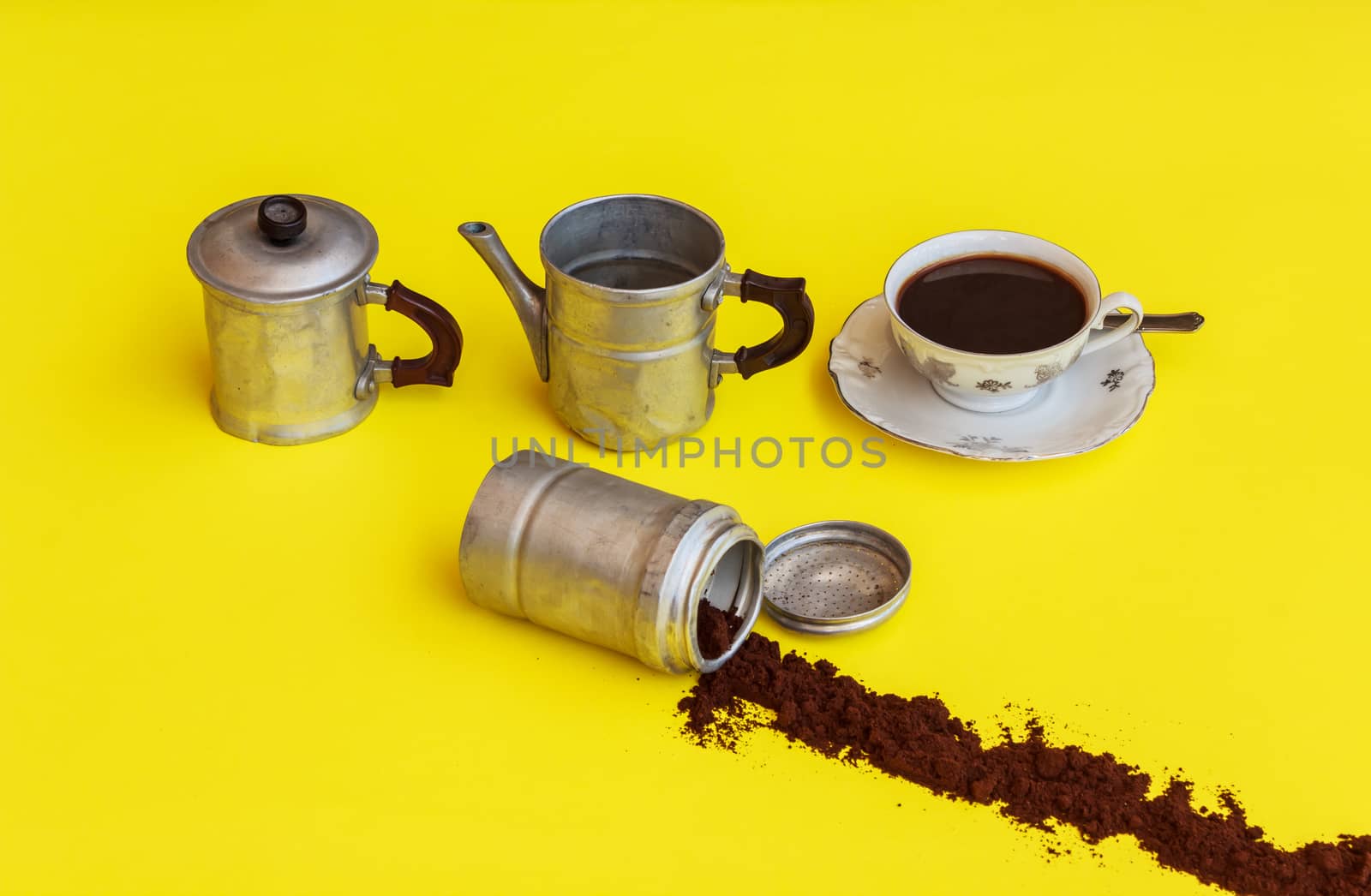 the components  of a coffee maker with alongside  the cup full o by moorea