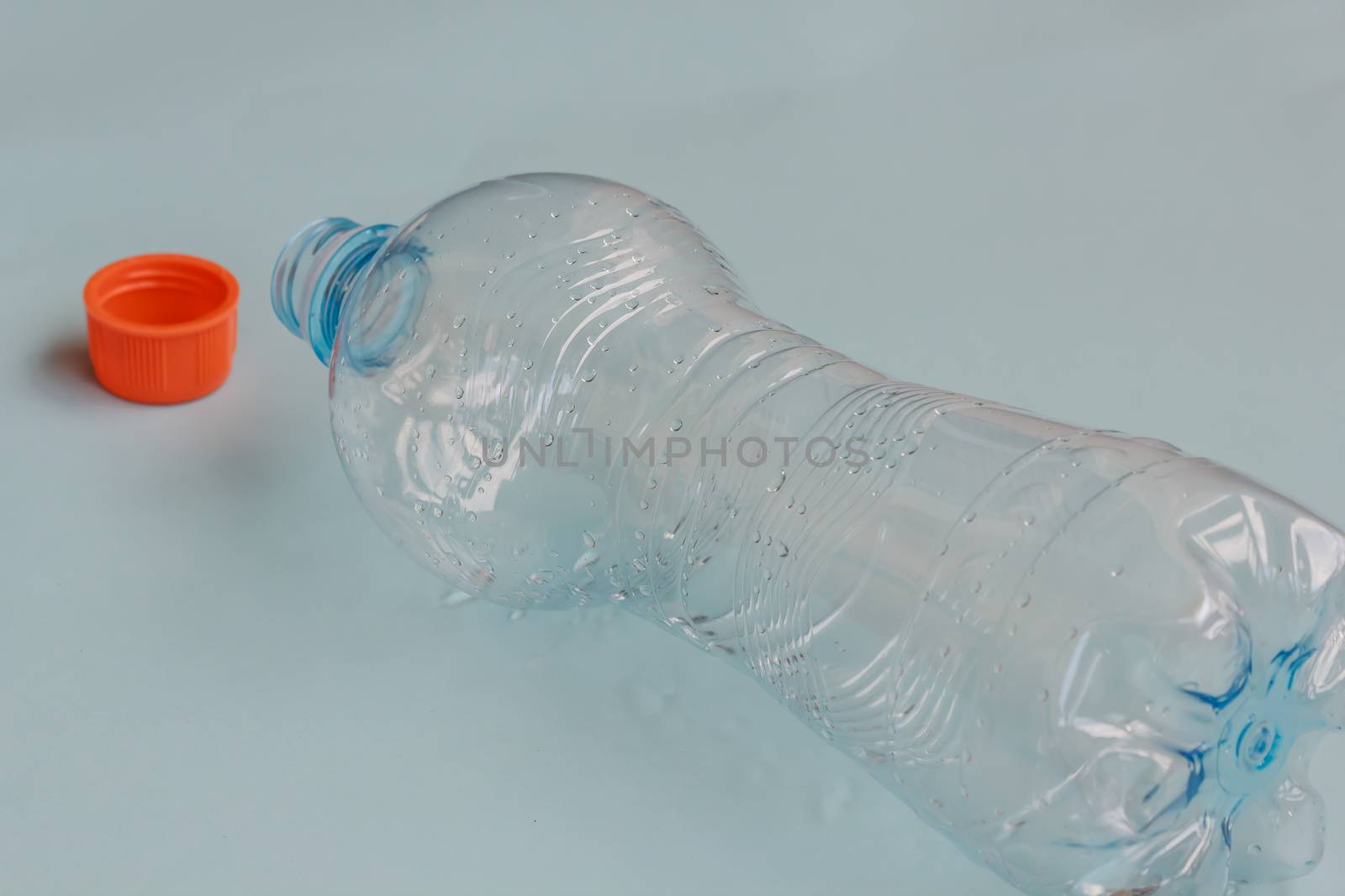a bottle of fresh water emptied and abandoned