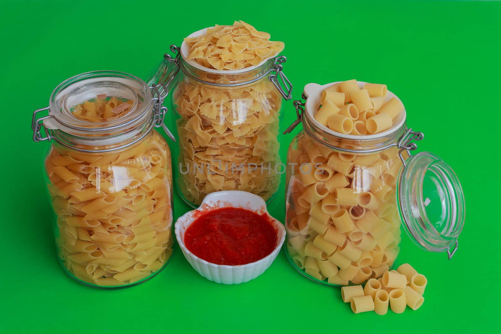 three jars of pasta with red sauce bowl by moorea