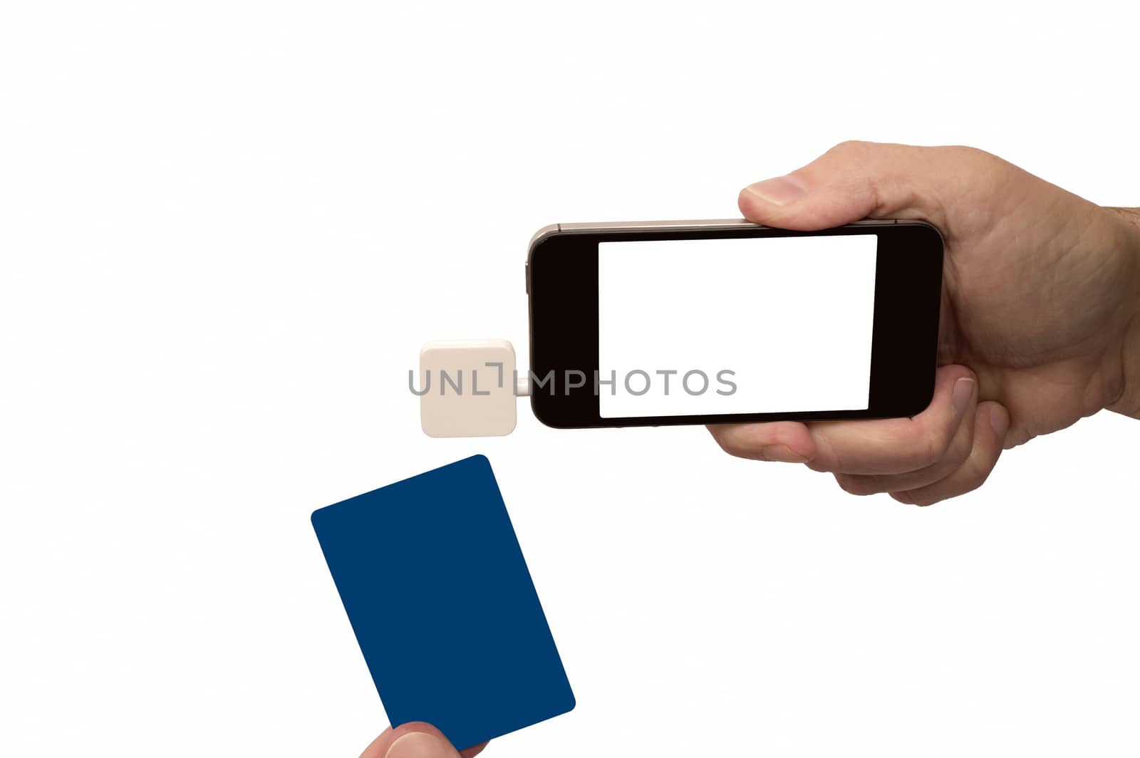 Hand holding mobile phone with card reader isolated on white.