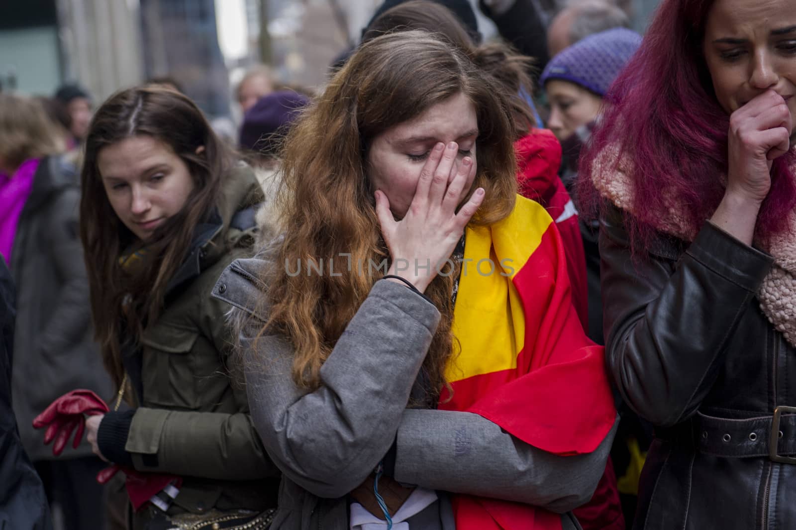 CANADA, Montreal: Women cry at a vigil in Montreal, Canada on March 23, 2016 for the victims of the attacks in Brussels, Belgium that killed at least 30 people and injured hundreds of others the day before. Responsibility for the bombings at Zavetum airport and Molenbeek metro station was later taken by the Islamic State terror group.