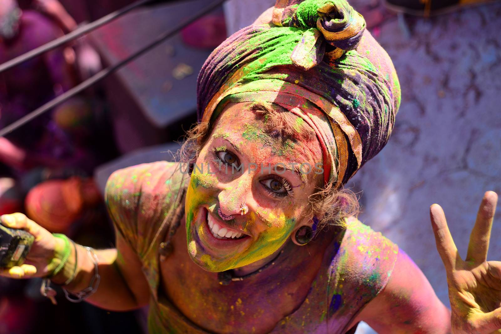 INDIA, Pushkar: A reveler wears vibrantly colorful paints during the Hindu Holi celebrations in Pushkar, Rajasthan, India on March 24, 2016. Holi is the festival of colors that also marks the advent of spring. It is celebrated across the country and in many other countries in the region.