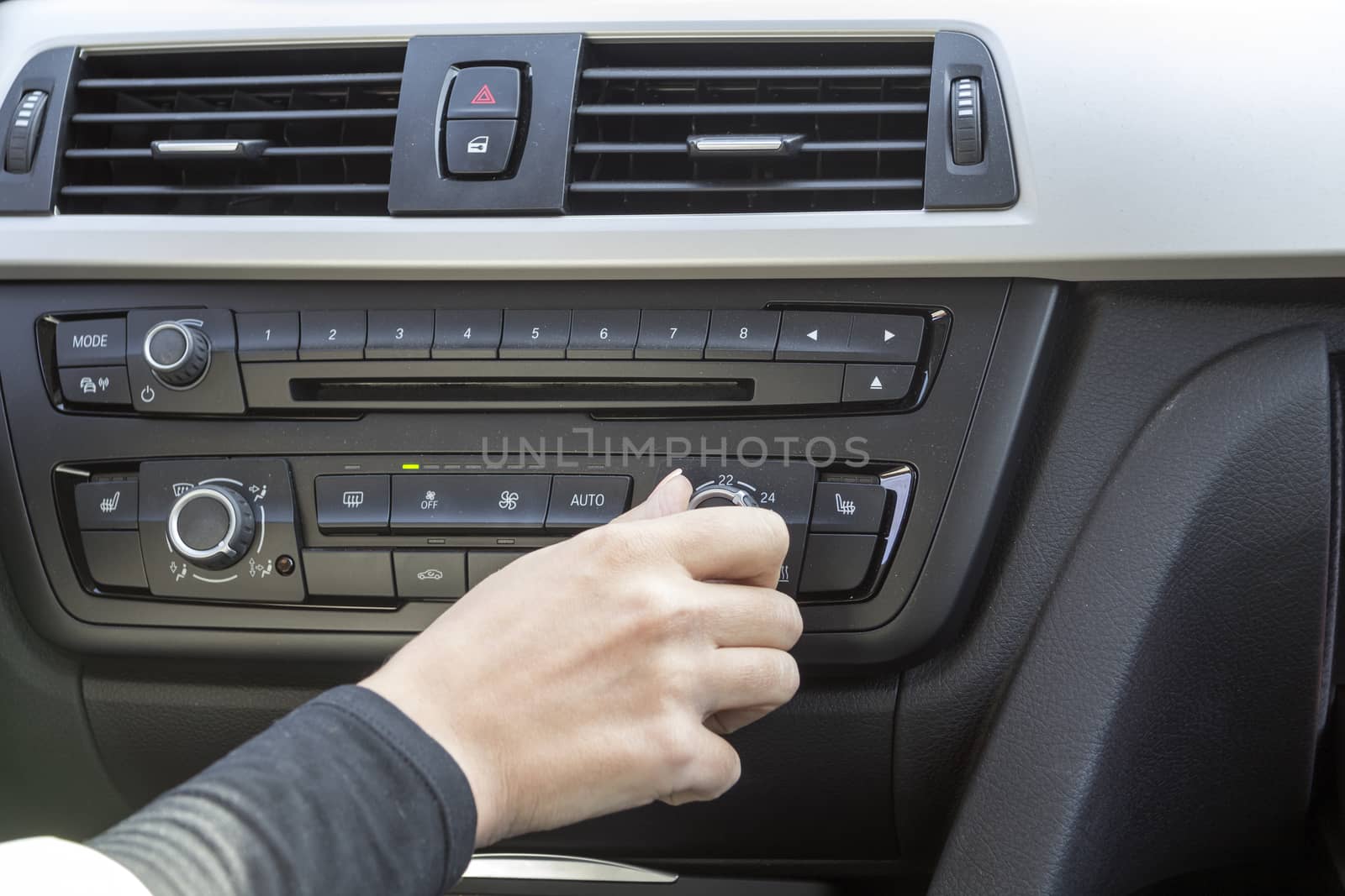 close-up of a girl's hand on the dashboard in a car