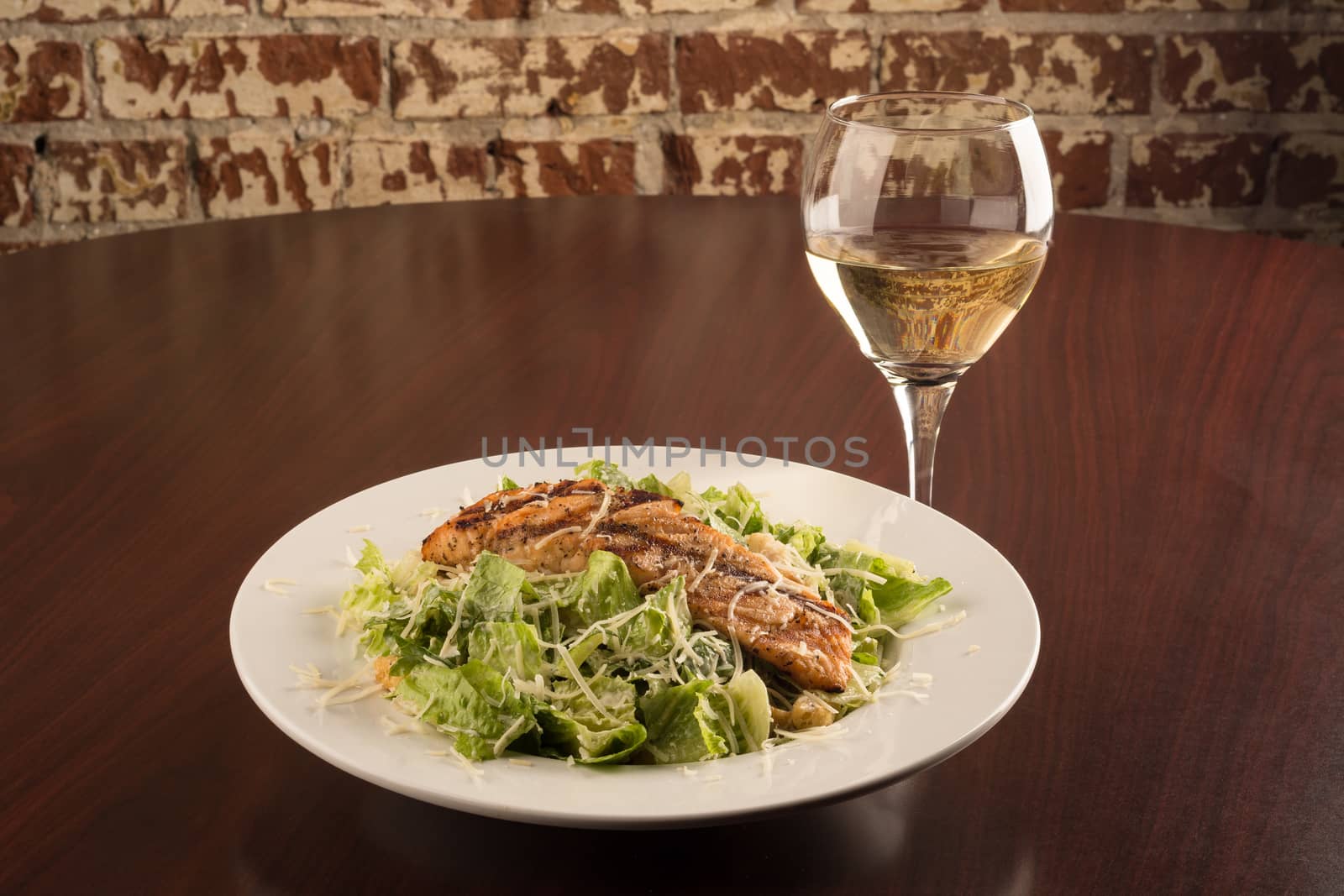 Grilled Chicken Cesar Salad with a glass of Chardonnay by rockinelle