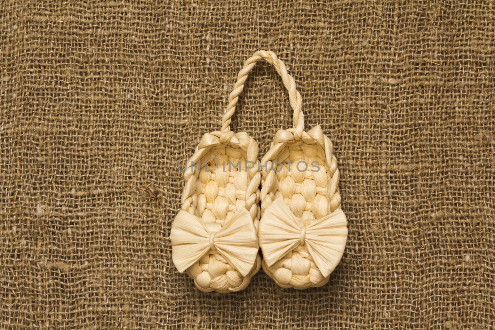 souvenir Old Russian sandals made of bark on a Brown background