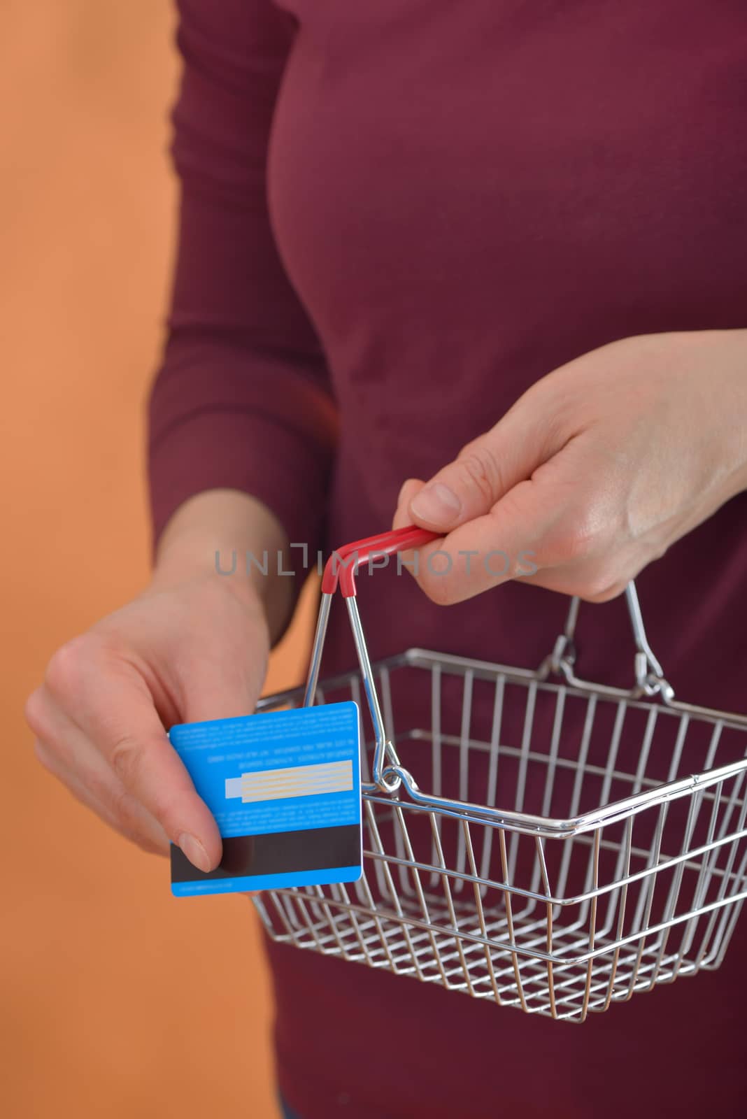 Shopping Cart and woman holding credit
