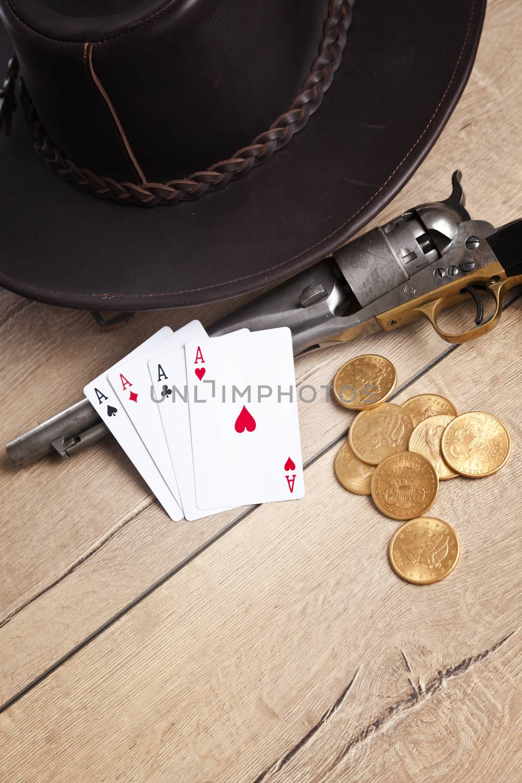 gambling and crime concept with gun, cards and golden coins