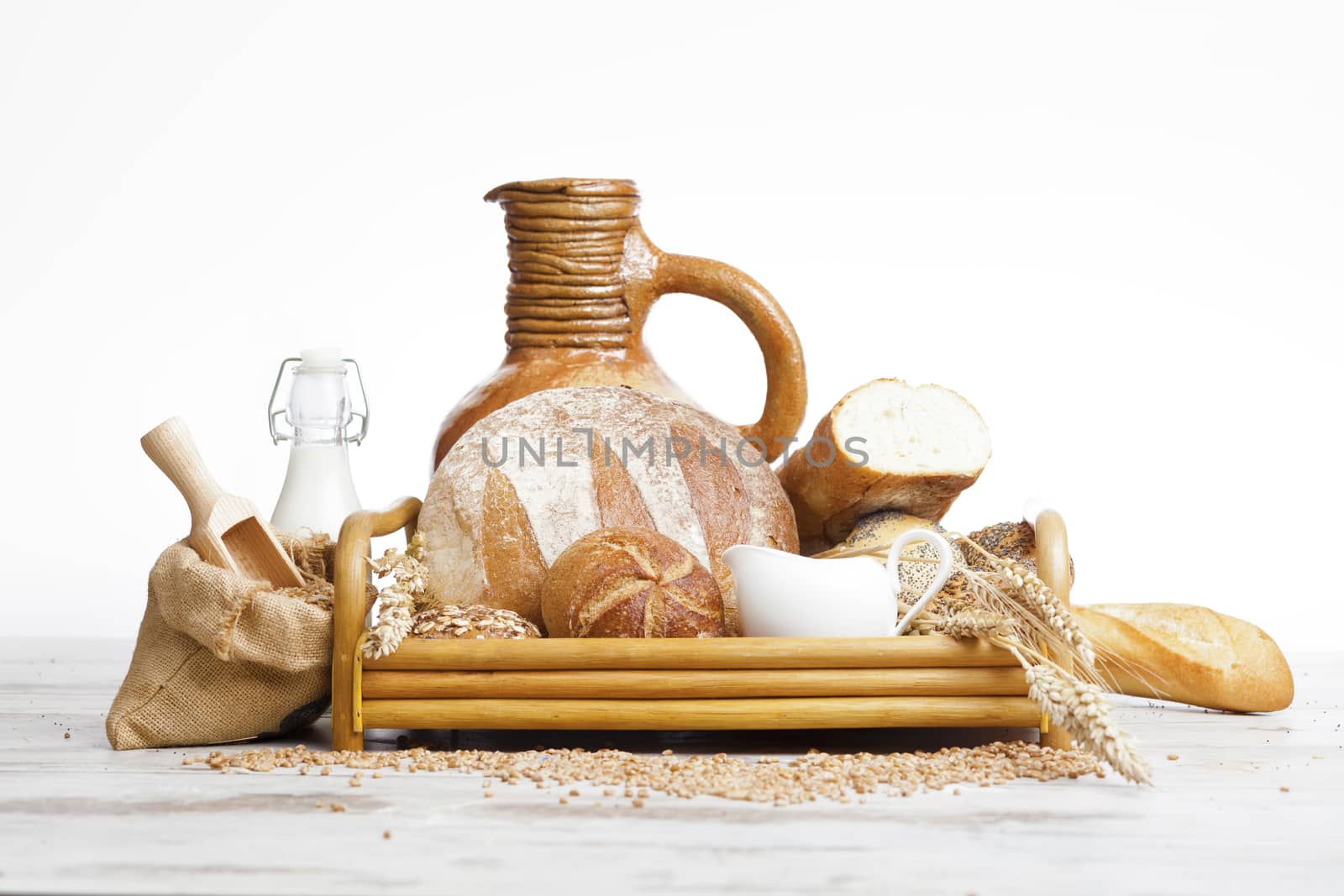 Freshly baked bread,honey and eggs on wooden vintage table