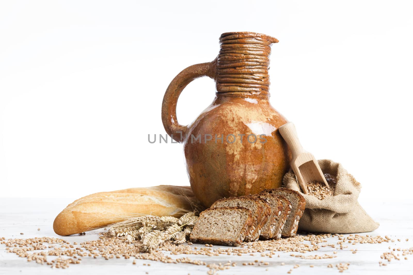 Freshly baked bread,honey and eggs on wooden vintage table