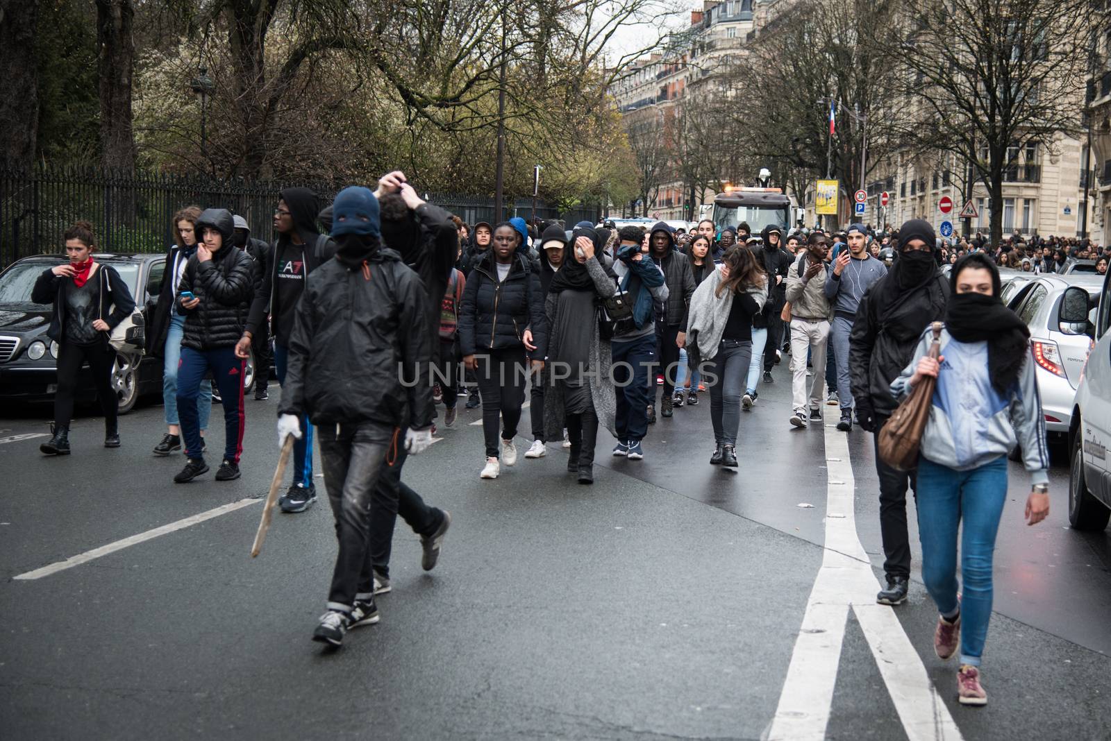FRANCE, Paris: High-school students protest against alledged police violence on a student during a demonstration of youths against the French labour law reform, on March 25, 2016 in the 19th arrondissement of Paris.A video of a policeman punching a student went viral on social media on March 24, and an enquiry has been opened into the incident. Tens of thousands of students protesting labour reforms took to the streets across France on March 24, torching cars in Paris and clashing with riot police who responded with tear gas and made more than 30 arrests.