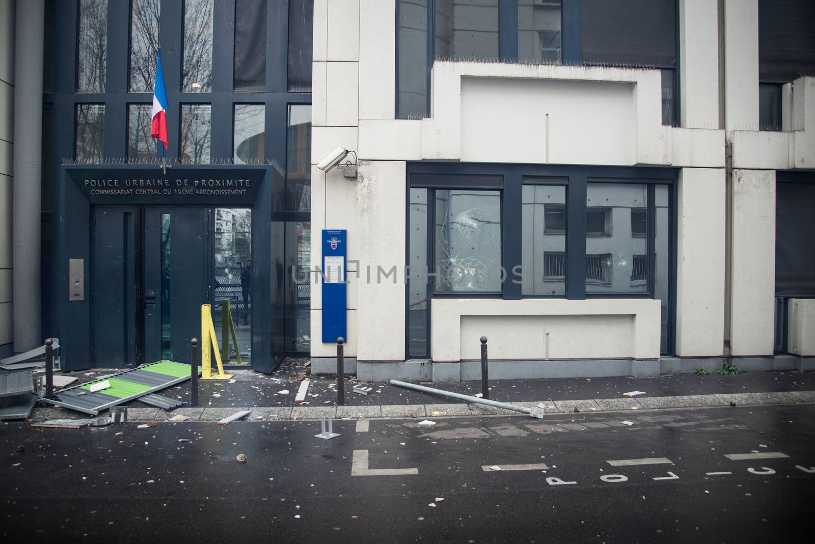 FRANCE, Paris: A police station of Paris 19th arrondissement is seen damaged, on March 25, 2016, after young people throw projectile against it, in a sign of protest against alledged police violence on a student during a demonstration of youths against the French labour law reform.A video of a policeman punching a student went viral on social media on March 24, and an enquiry has been opened into the incident. Tens of thousands of students protesting labour reforms took to the streets across France on March 24, torching cars in Paris and clashing with riot police who responded with tear gas and made more than 30 arrests.