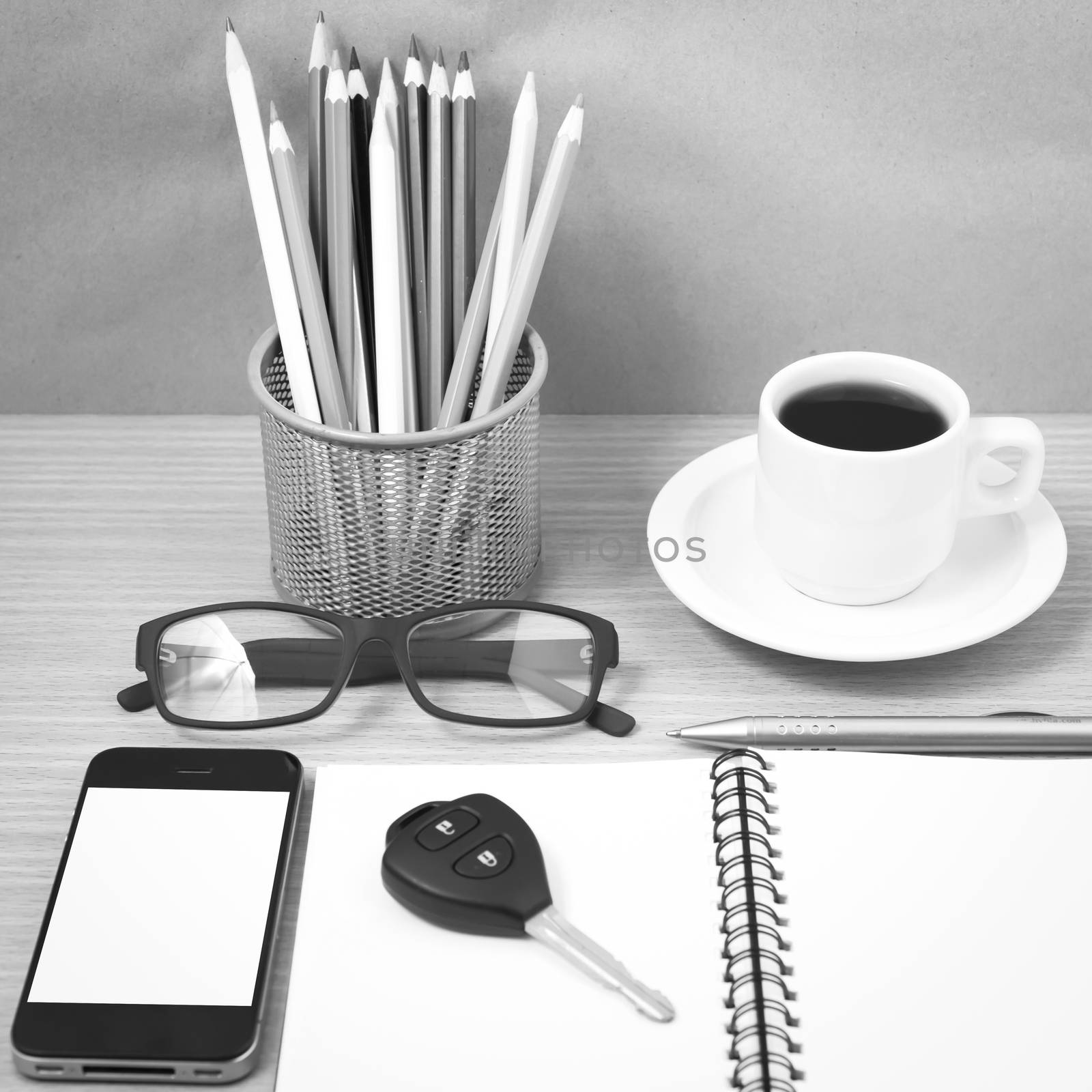 office desk : coffee and phone with key,eyeglasses,notepad,penci by ammza12