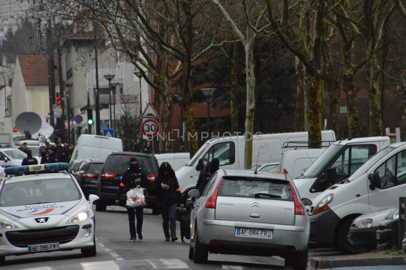 FRANCE, Argenteuil: Police officers walk in a street after a raid in the Argenteuil neighbourhood northwest of Paris on March 25, 2016. French Interior Minister Bernard Cazeneuve said police had arrested a suspect in the Paris area today who was in the advanced stages of a plot to attack France.