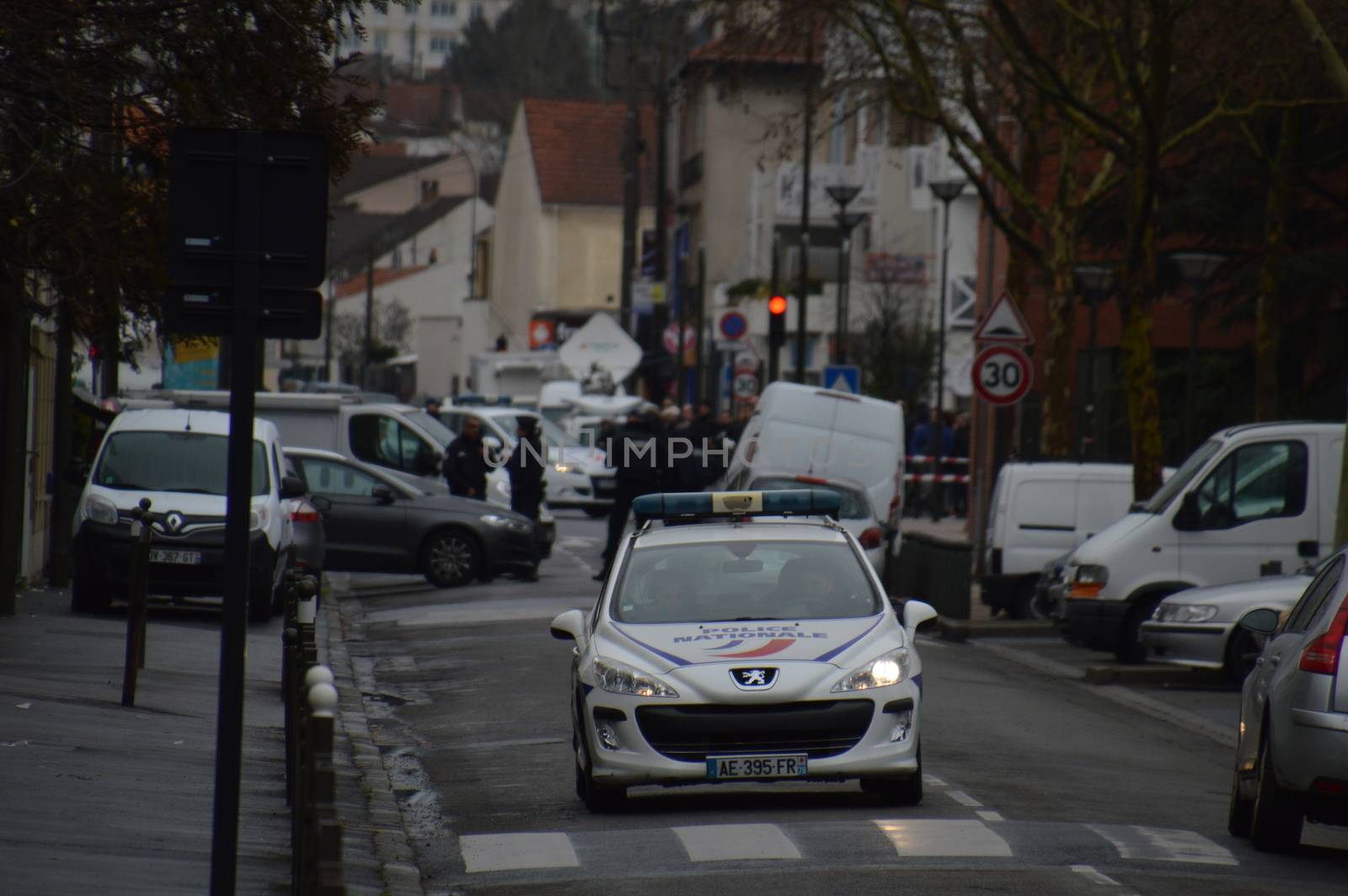 FRANCE, Argenteuil: A police car patrol after a raid in the Argenteuil neighbourhood northwest of Paris on March 25, 2016. French Interior Minister Bernard Cazeneuve said police had arrested a suspect in the Paris area today who was in the advanced stages of a plot to attack France.