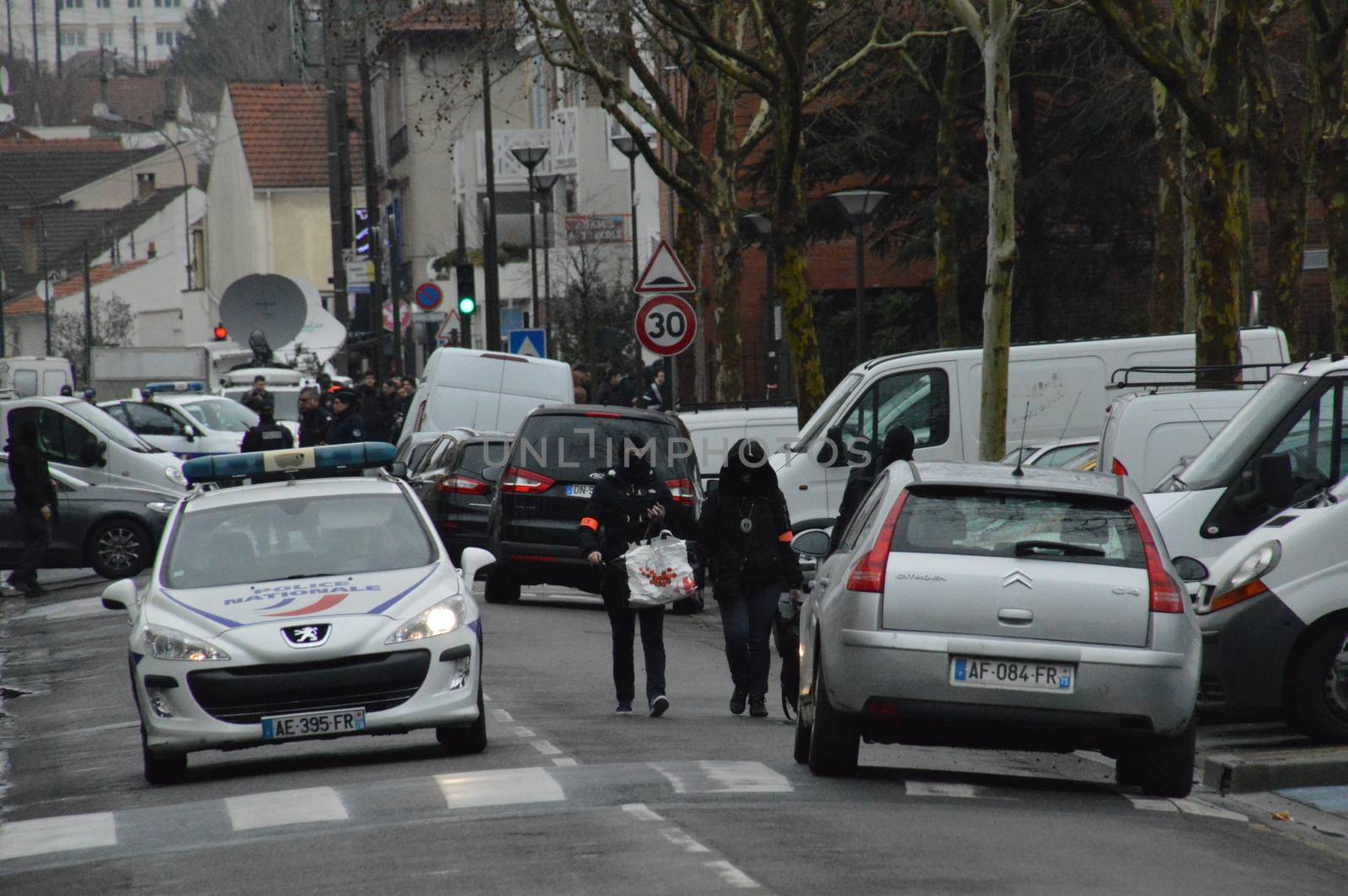 FRANCE, Argenteuil: Police officers walk in a street after a raid in the Argenteuil neighbourhood northwest of Paris on March 25, 2016. French Interior Minister Bernard Cazeneuve said police had arrested a suspect in the Paris area today who was in the advanced stages of a plot to attack France.