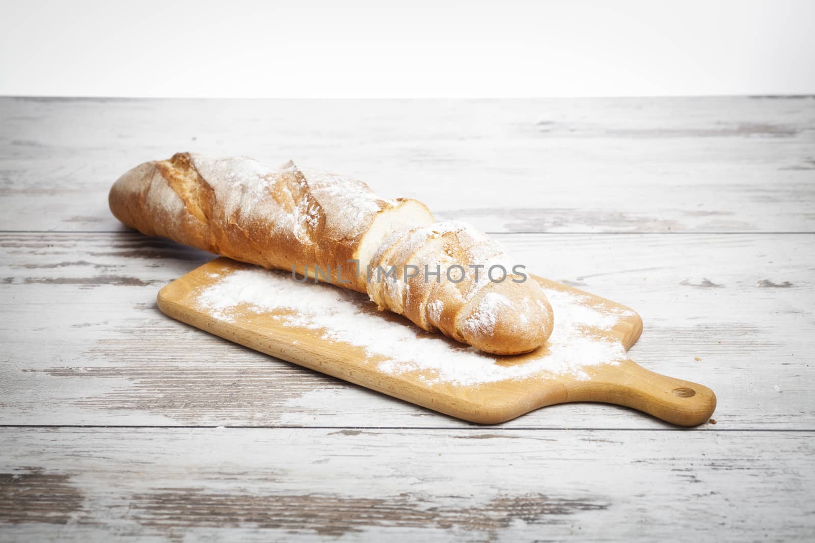 Freshly baked bread rolls, wheat ears and honey