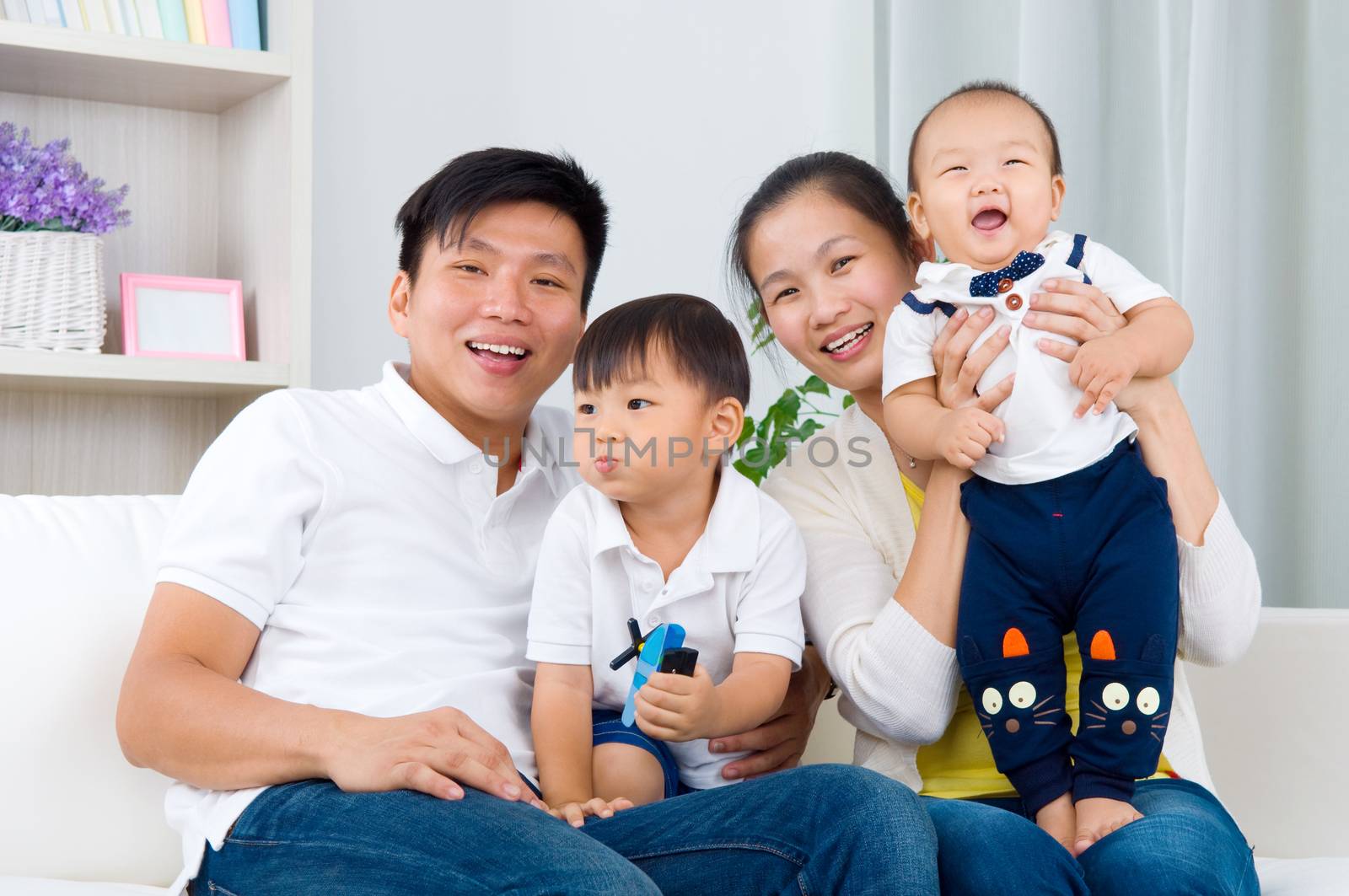 Indoor portrait of asian family