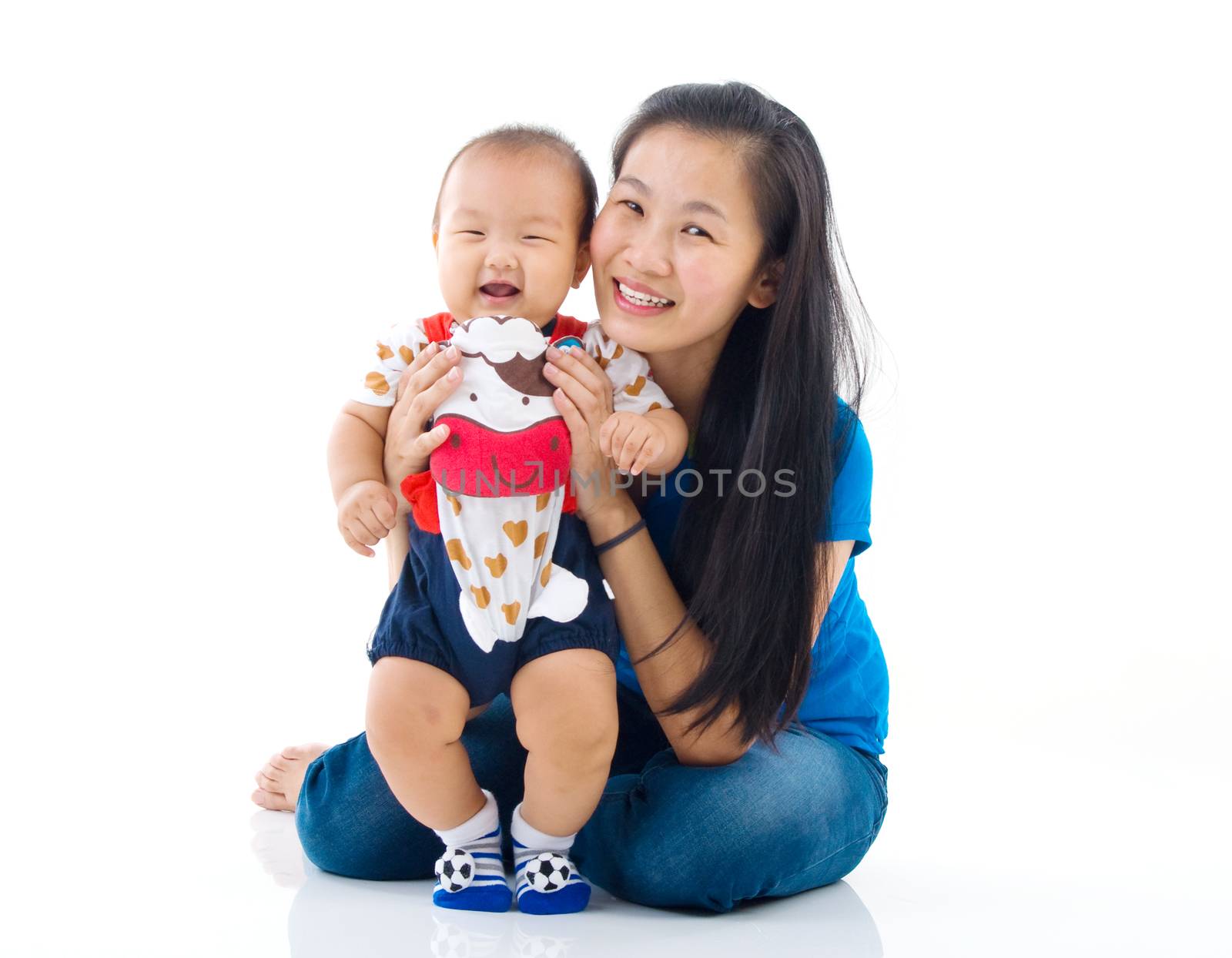 Asian mother playing with baby boy