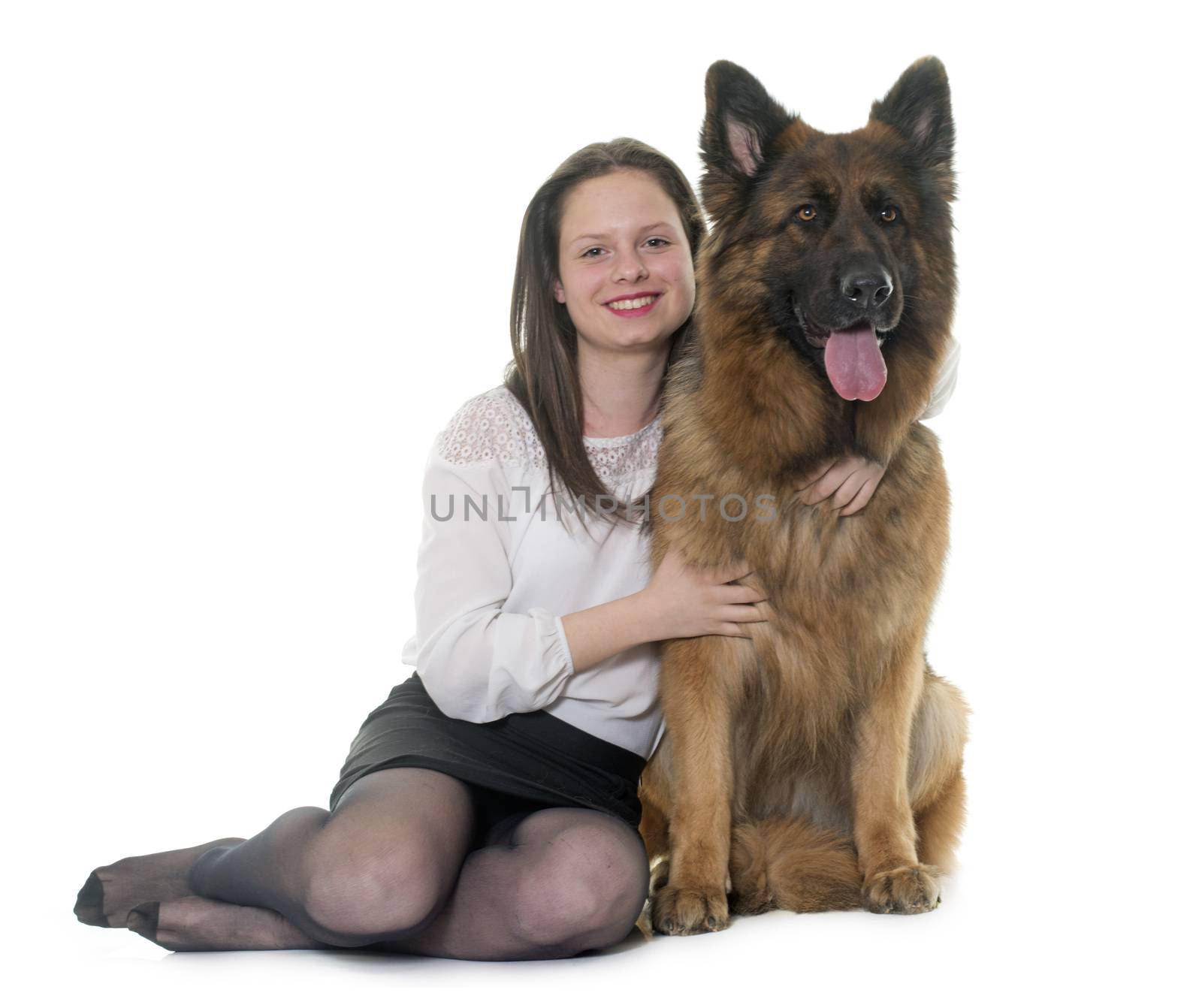 teenager and adult german shepherd in front of white background
