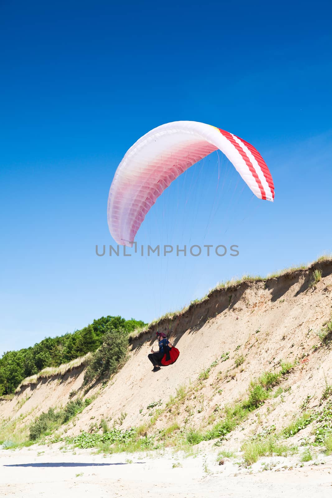 paraglider on the blue sky