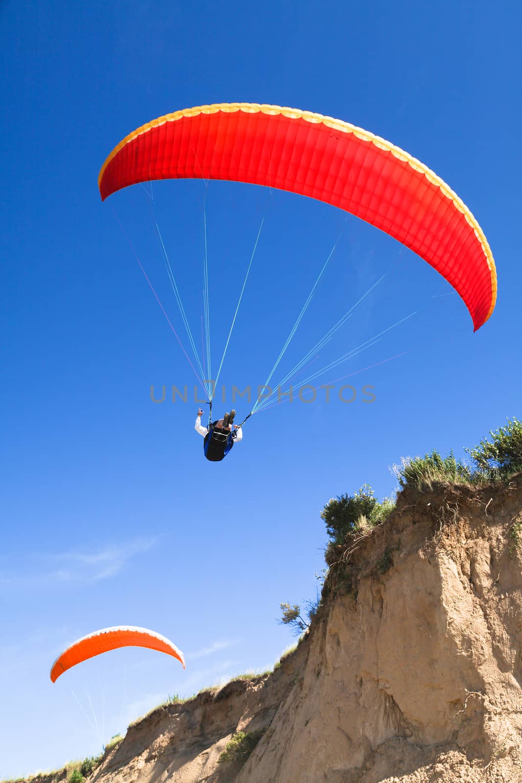 paraglider on the blue sky