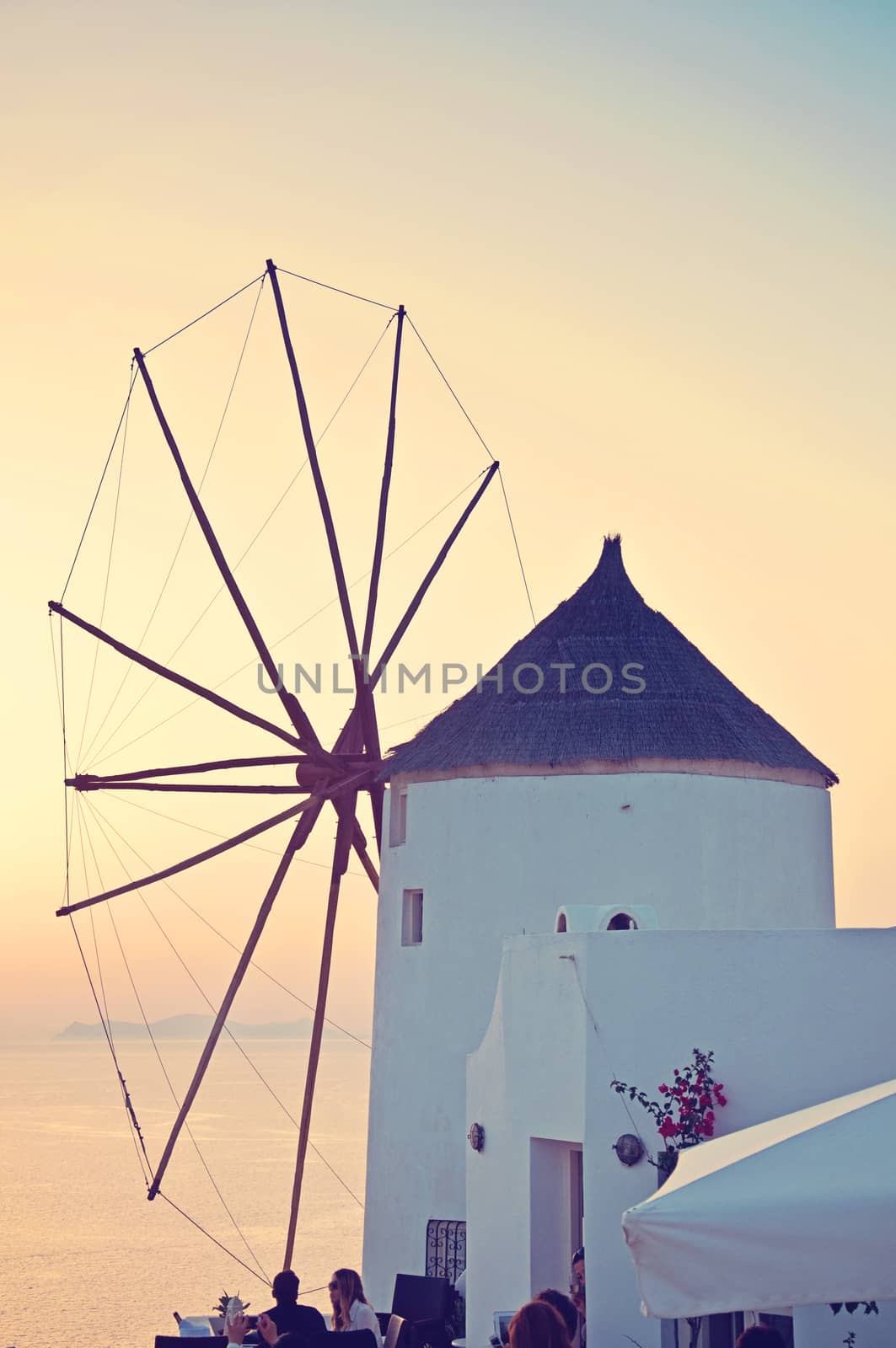 Windmill in Oia, Santorini. Oia is a village in the north west edge of the Santorini island with white houses, narrow streets and amazing seaviews.
