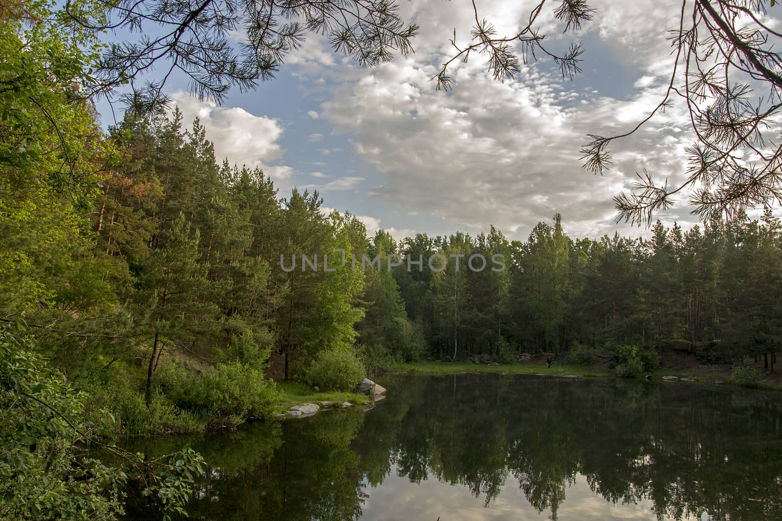 Lake in the stone canyon surrounded by forest by Irene1601