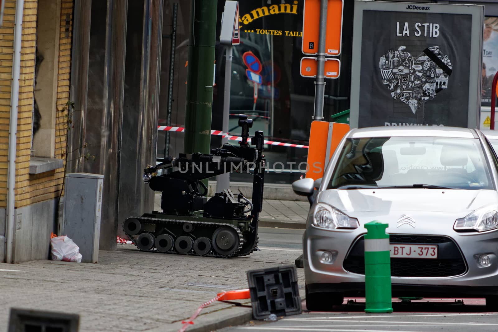 BELGIUM, Brussels: A SEDEE bomb disposal robot is seen in action on Vanderkindere street, in Uccle district, southern Brussels on March 26, 2016 after suspicious bag pack was found. Buildings around Ici Paris XL shop on Vanderkindere street were evacuated, public transports were temporarily shut down until police found out it was a false alarm. Brussels has been on high alert since the terror attacks of 22 March in the Belgian capital that left at least 31 dead. 