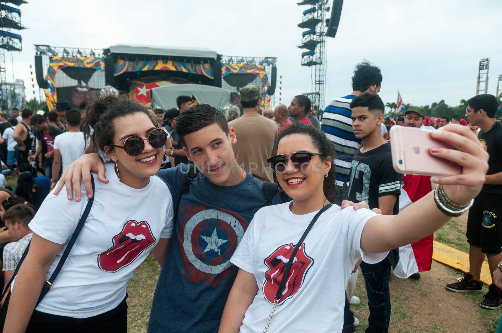 CUBA, Havana: Rolling Stones fans make a selfie of themselves as others wait for the start of a free concert on March 25, 2016 in Havana, Cuba. Thousands of fans waited for the Rolling Stones to play for the first time in Cuba, after the music was once banned by the government.