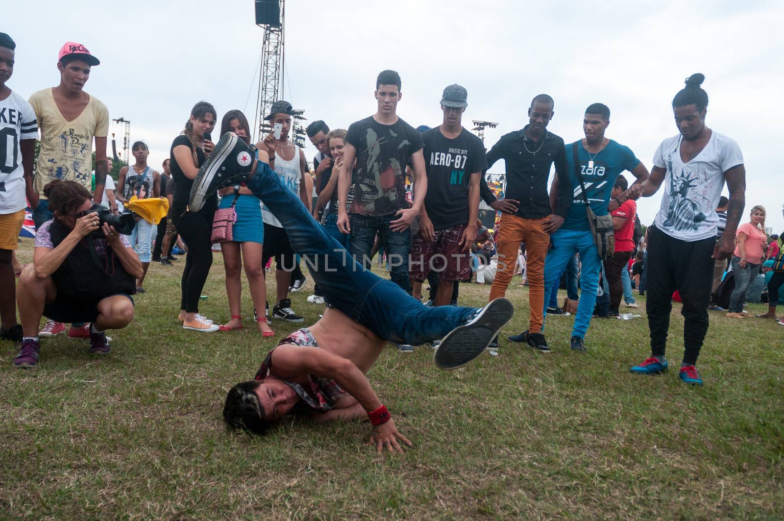 CUBA, Havana: Rolling Stones fans wait for the start of a free concert on March 25, 2016 in Havana, Cuba. Thousands of fans waited for the Rolling Stones to play for the first time in Cuba, after the music was once banned by the government.