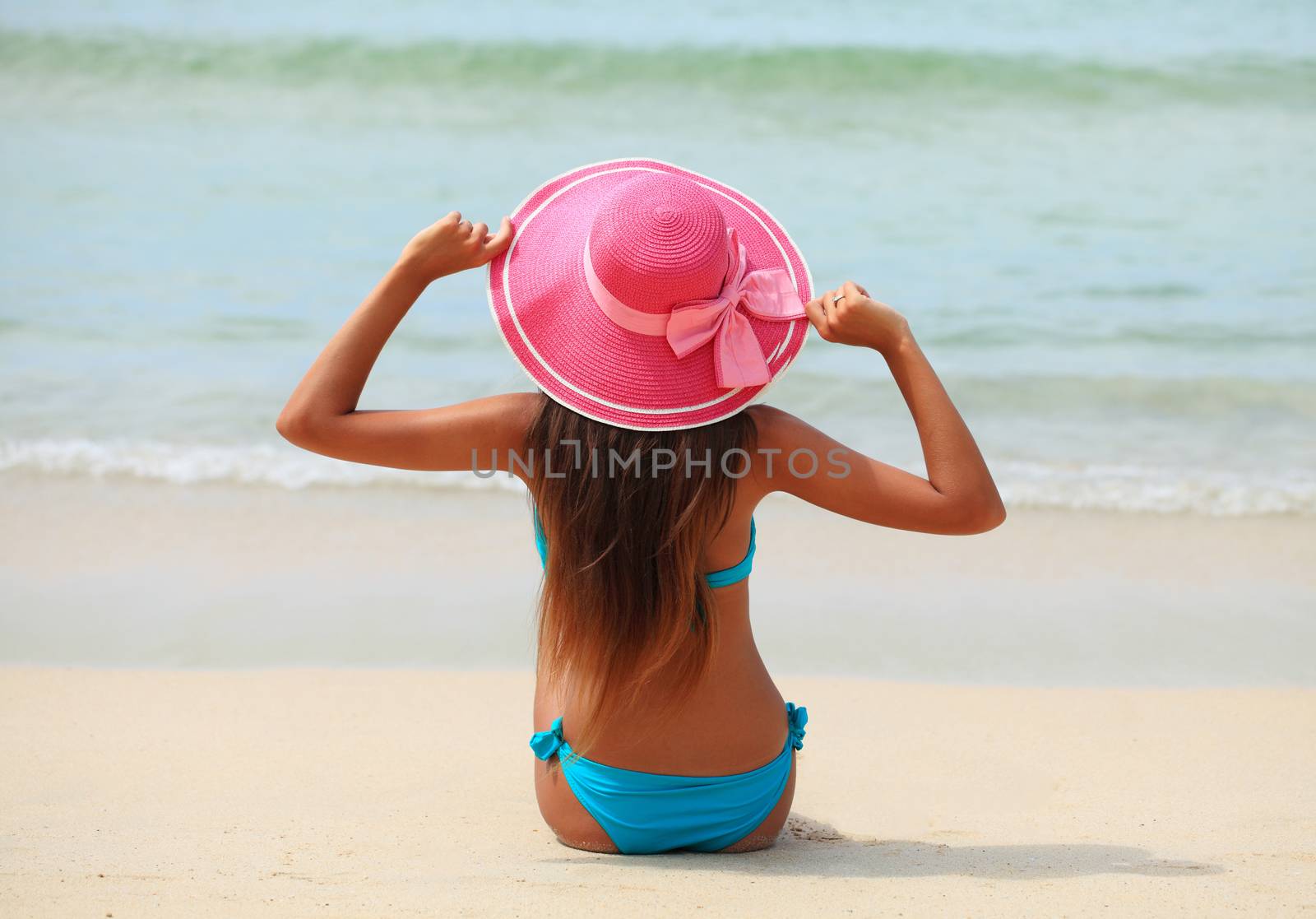 Woman on tropical beach by ALotOfPeople