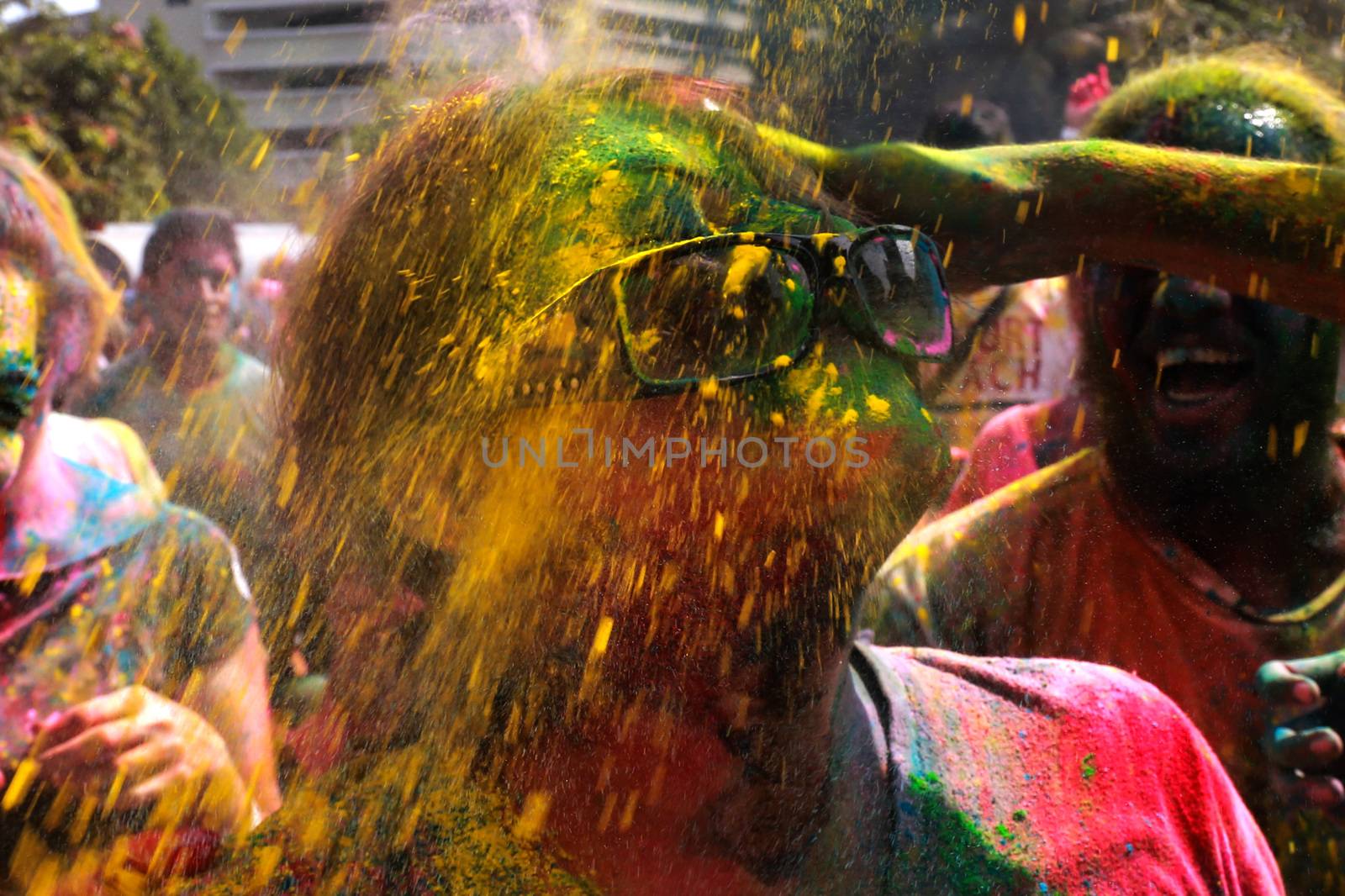 MALAYSIA, Kuala Lumpur: Revellers dance and spray colored powder during the Holi Festival in Kuala Lumpur on March 26, 2016. Holi, also called the Festival of Colours, is a popular Hindu spring festival observed in India, Malaysia and other countries at the end of the winter season on the last full moon day of the lunar month. 