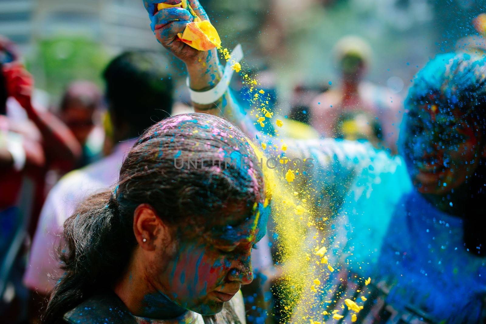 MALAYSIA, Kuala Lumpur: Revellers dance and spray colored powder during the Holi Festival in Kuala Lumpur on March 26, 2016. Holi, also called the Festival of Colours, is a popular Hindu spring festival observed in India, Malaysia and other countries at the end of the winter season on the last full moon day of the lunar month. 