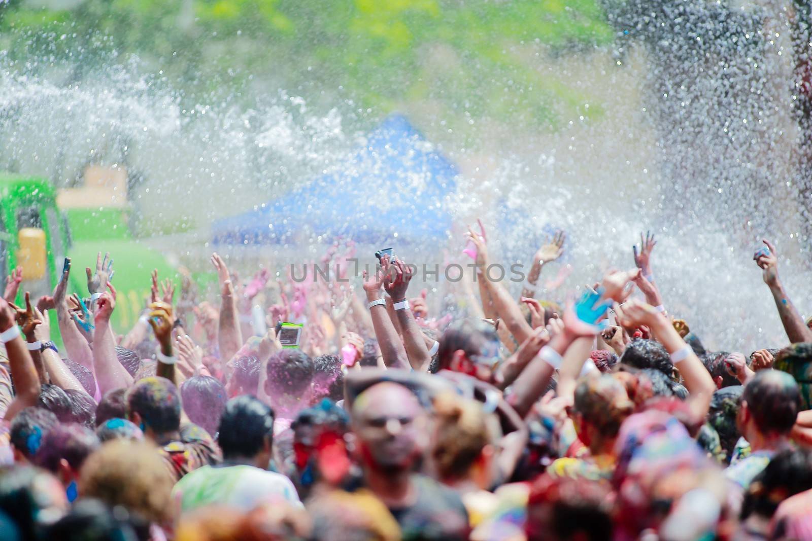 MALAYSIA, Kuala Lumpur: Revellers dance and spray colored powder during the Holi Festival in Kuala Lumpur on March 26, 2016. Holi, also called the Festival of Colours, is a popular Hindu spring festival observed in India, Malaysia and other countries at the end of the winter season on the last full moon day of the lunar month. 
