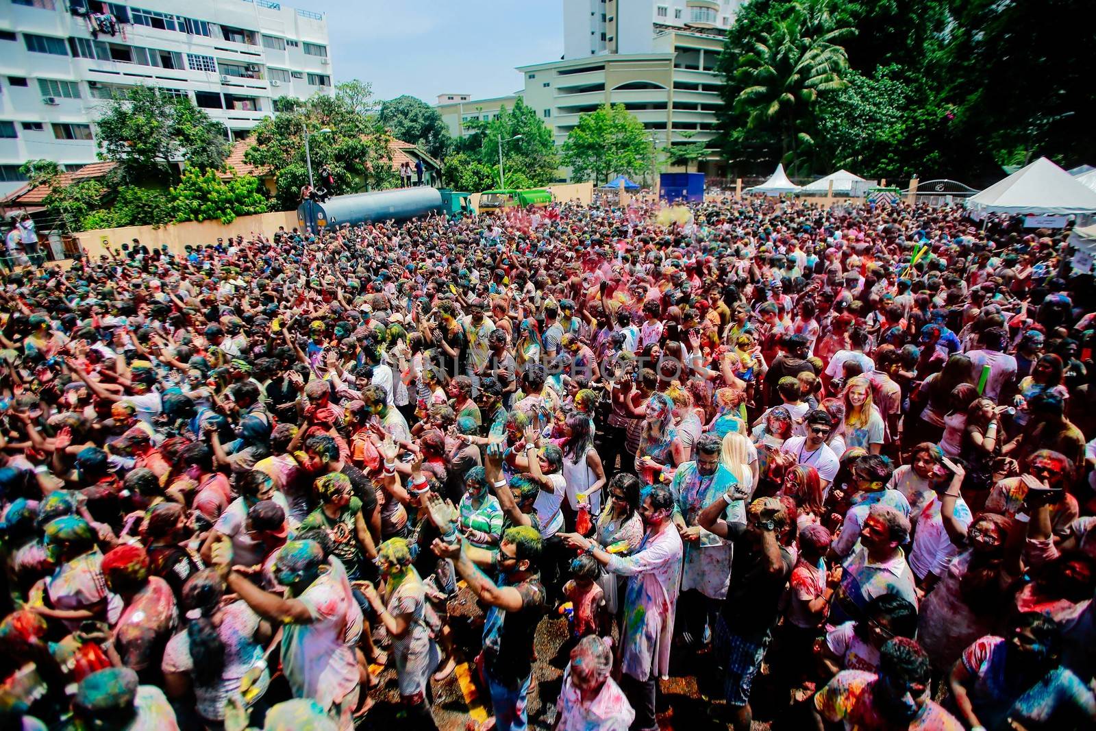 MALAYSIA, Kuala Lumpur: Revellers dance and spray colored powder during the Holi Festival in Kuala Lumpur on March 26, 2016. Holi, also called the Festival of Colours, is a popular Hindu spring festival observed in India, Malaysia and other countries at the end of the winter season on the last full moon day of the lunar month. 