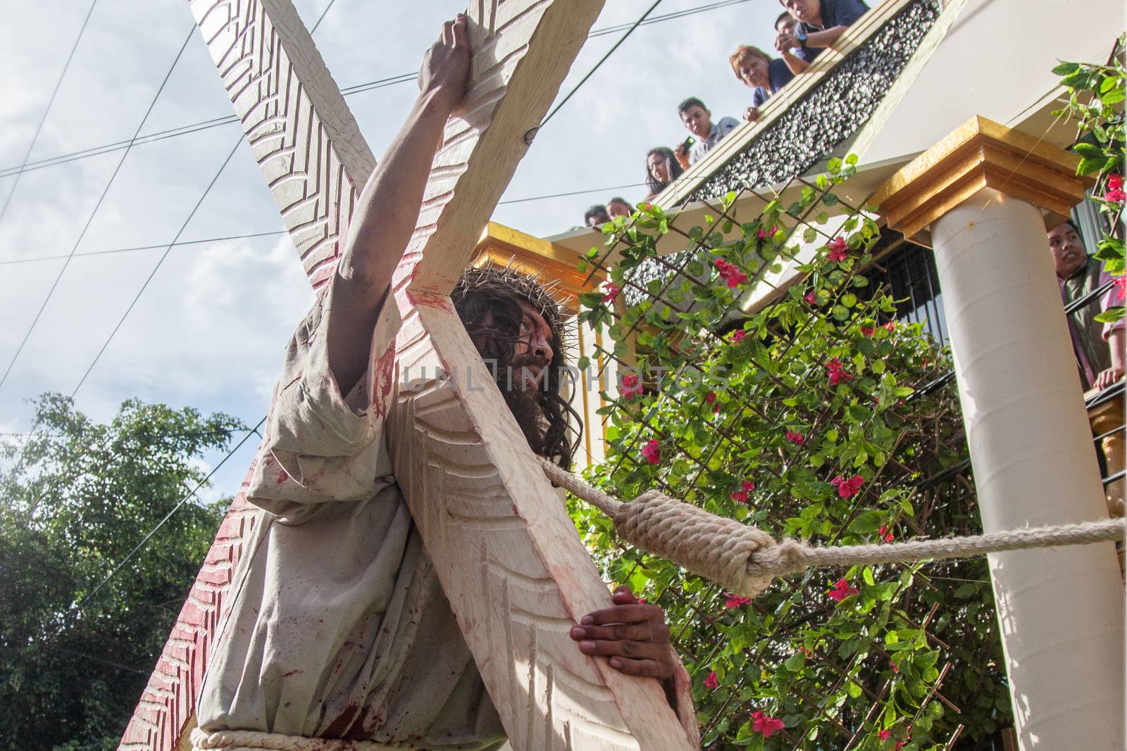 MEXICO, Mexico City: A man portraying Jesus carries a cross through the streets of Mexico City on March 25, 2016, as part of a Good Friday procession. The procession went through the Via Crucis, or stations of the cross, which tell of the crucifixion of Jesus.Good Friday is held on the Friday before Easter.