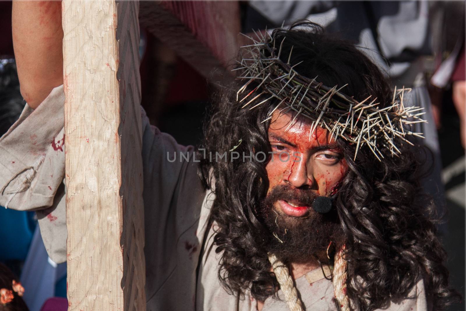 MEXICO, Mexico City: A man portraying Jesus carries a cross through the streets of Mexico City on March 25, 2016, as part of a Good Friday procession. The procession went through the Via Crucis, or stations of the cross, which tell of the crucifixion of Jesus.Good Friday is held on the Friday before Easter.