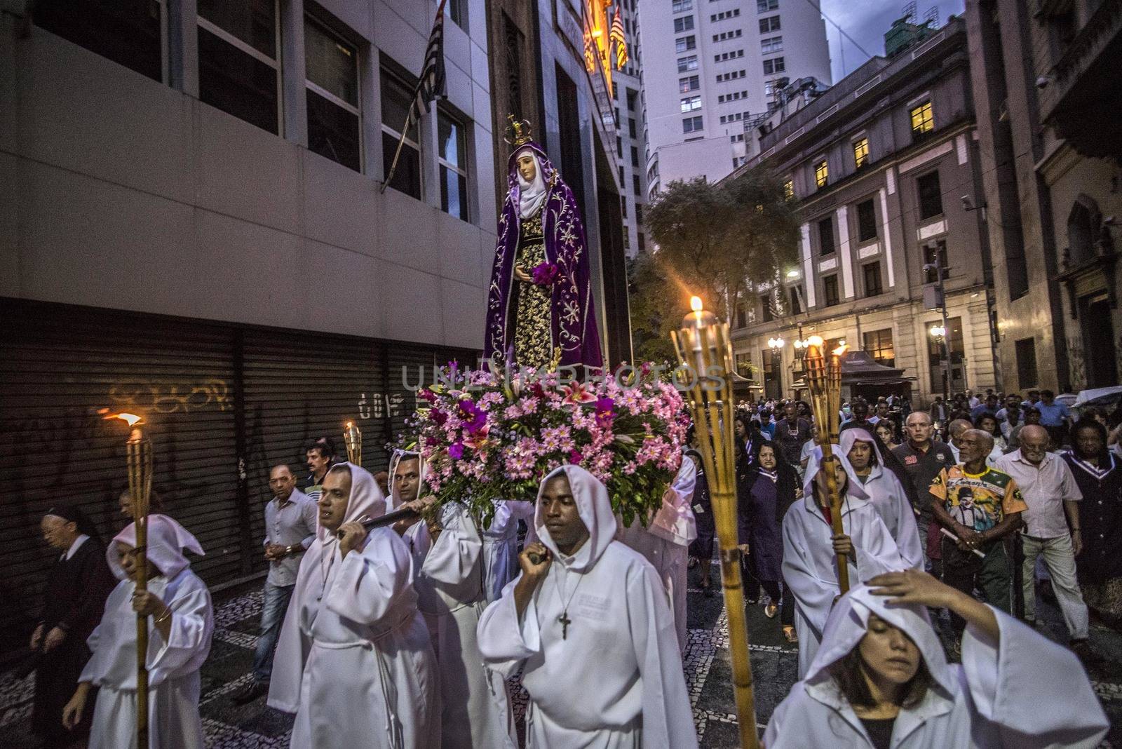 BRAZIL, Sao Paulo: Worshippers carry a statue of The Virgin Mary, as part of a Good Friday procession through the streets of Sao Paulo, Brazil on March 25, 2016.Good Friday is the Friday before Easter, which symbolizes the day that Jesus Christ was crucified and died.