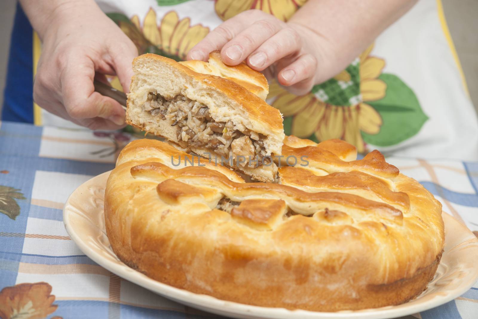 Cutting the tasty pie with filling by kozak
