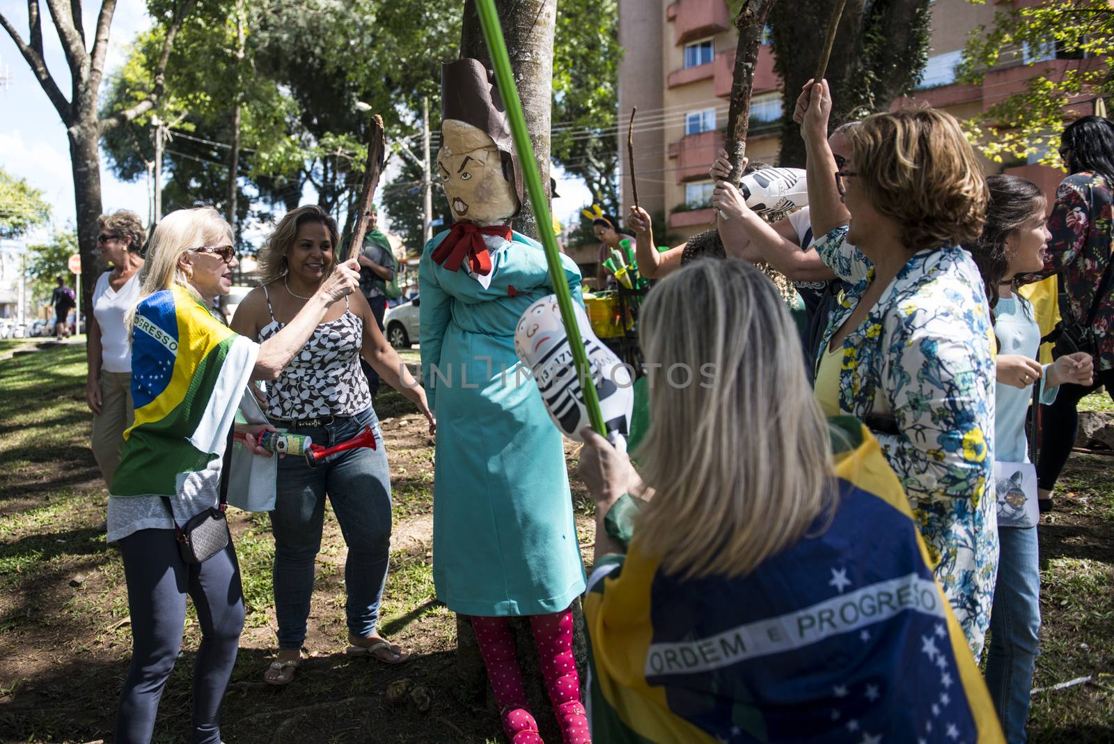 BRAZIL, Curitiba: Protesters beat effigies of President Dilma Rousseff and former President Lula in front of the Federal Court in Curitiba, Brazil on March 26, 2016.Traditionally on the Saturday before Easter, Catholics beat effigies of Judas the apostle. This year protesters in favor of impeachment of the President of Brazil, used the tradition as a political demonstration.